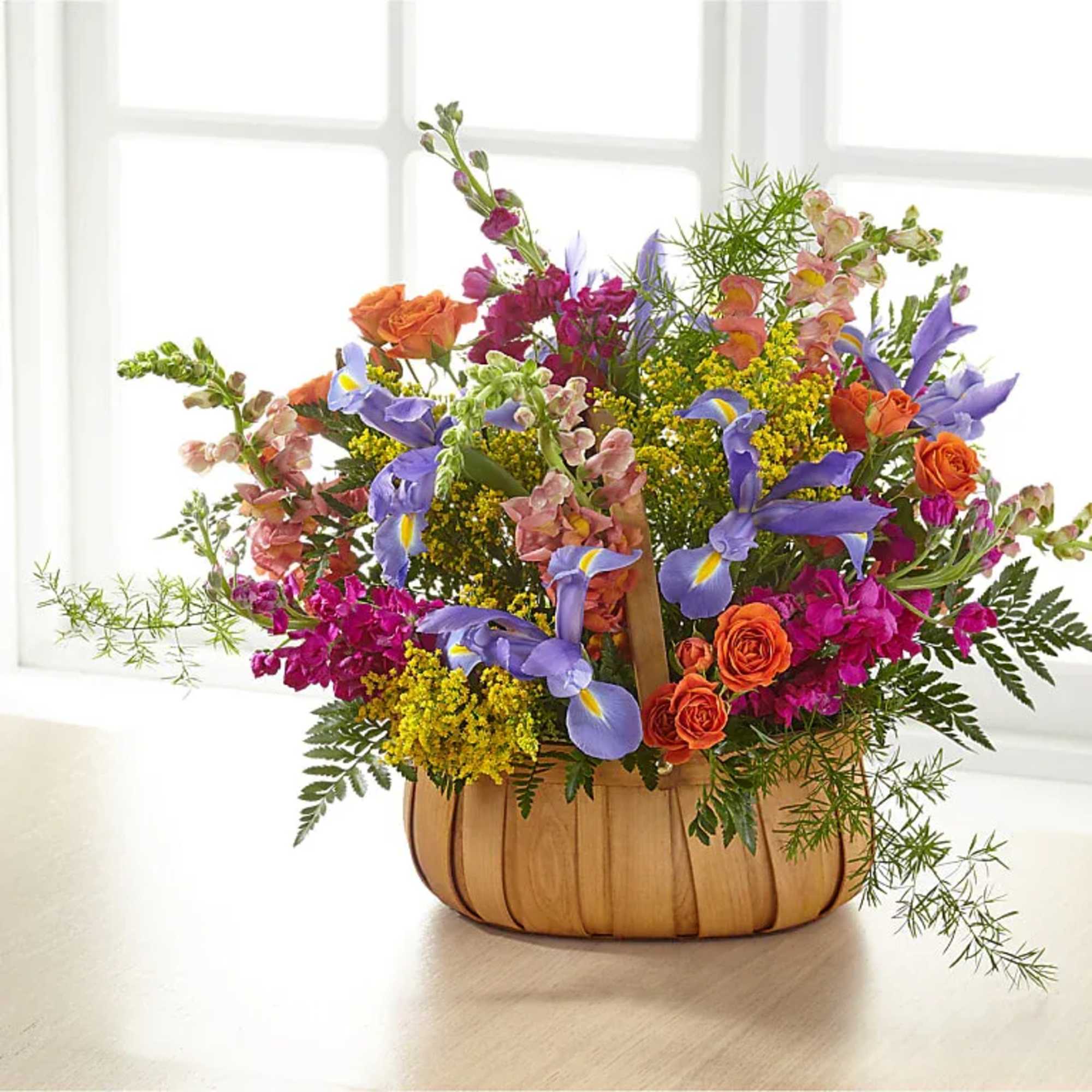 A gorgeous mix of beautiful, bright summer flowers offers an uplifting expression