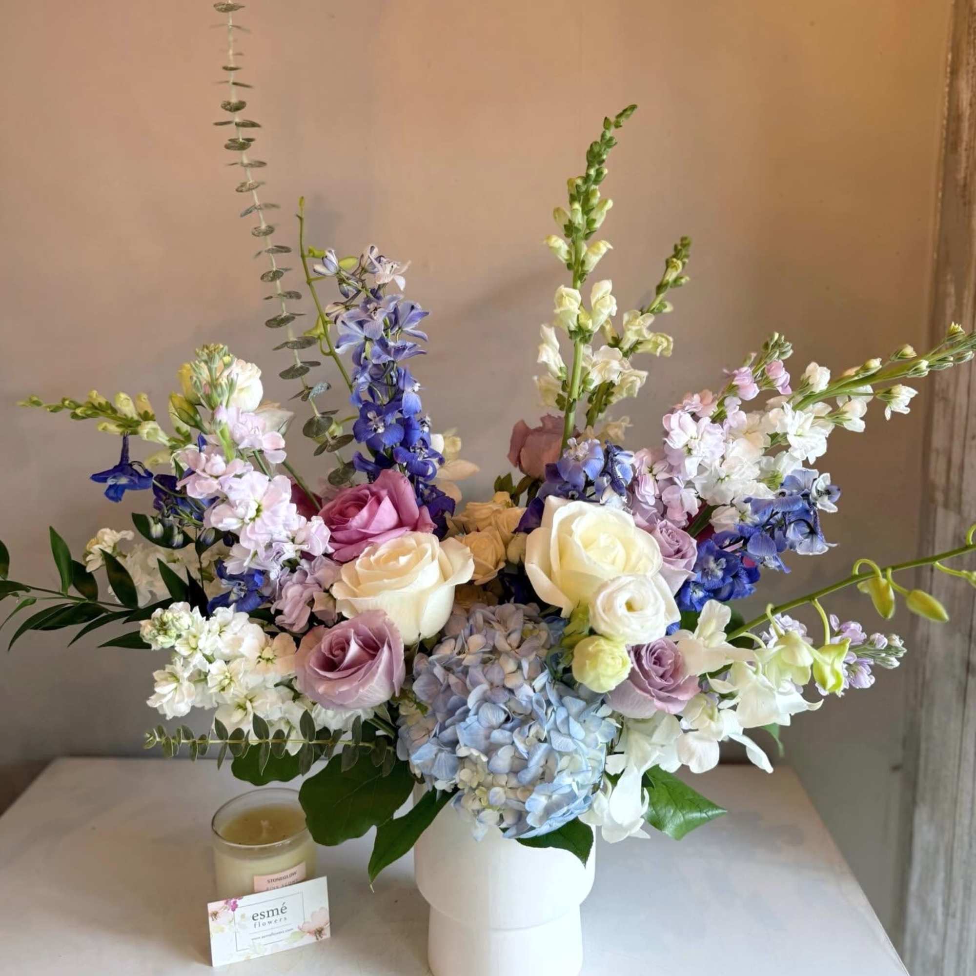 This asymmetric arrangement exudes timeless elegance with a refined palette of blue