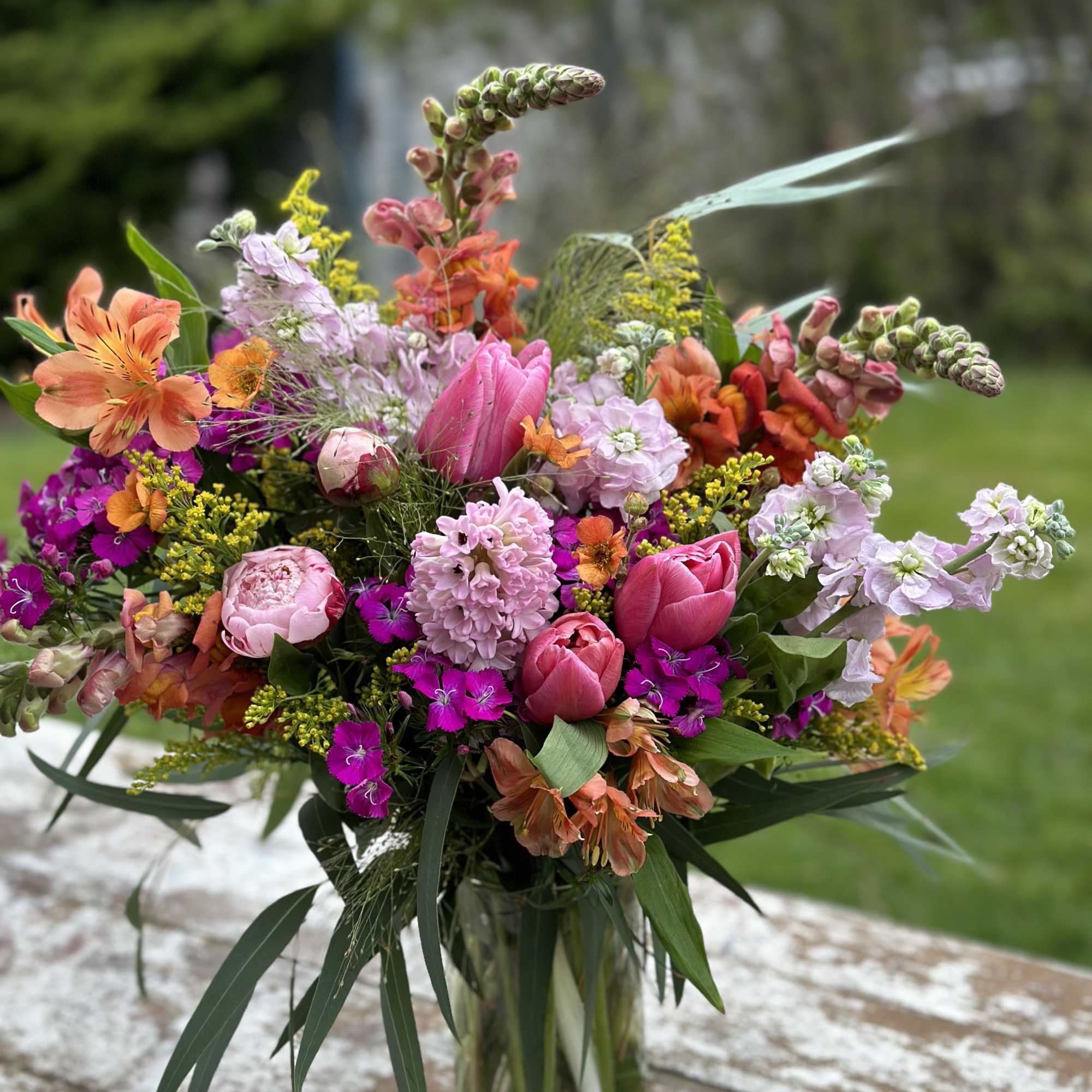 A Tall Arrangement in Sunset Hues of Orange, Pinks, and Yellows. 
*Please
