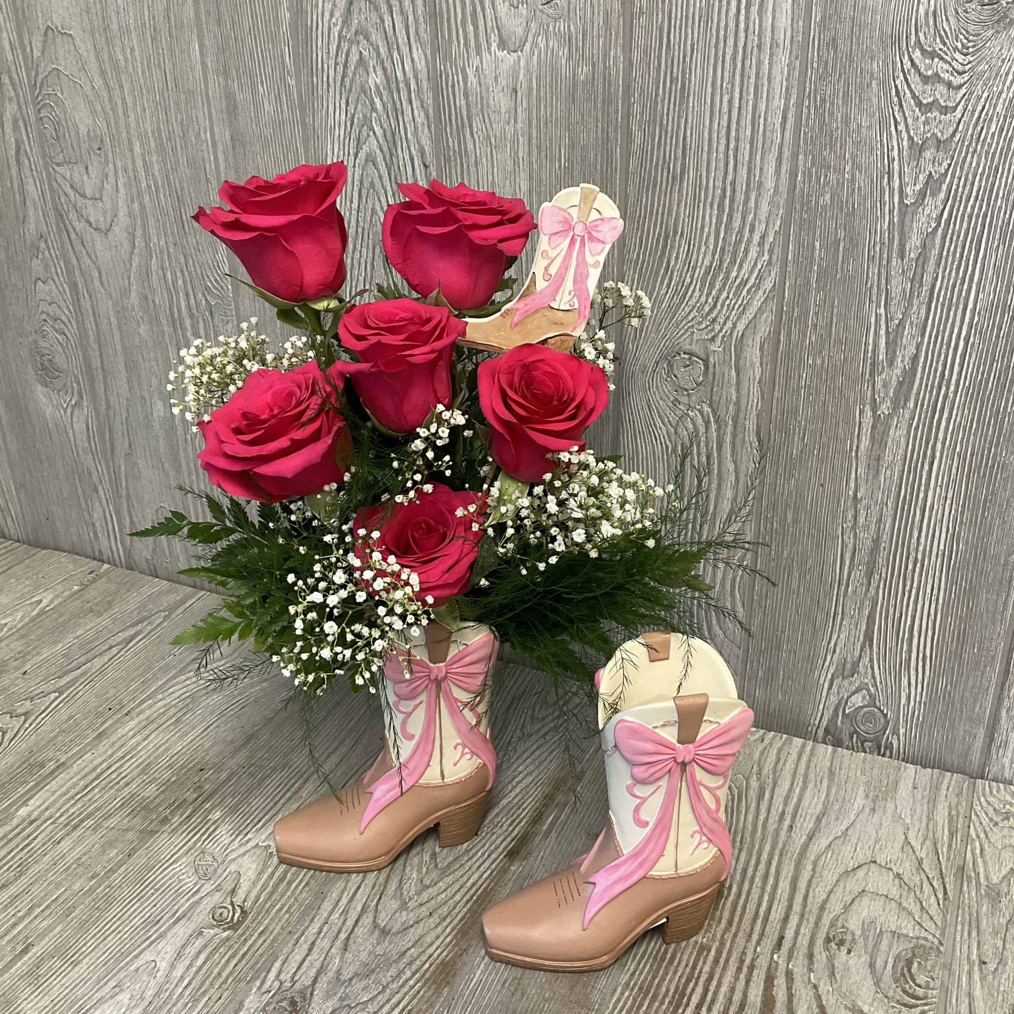 Fresh cut flowers arranged in a keepsake cowgirl boot container. Flowers and