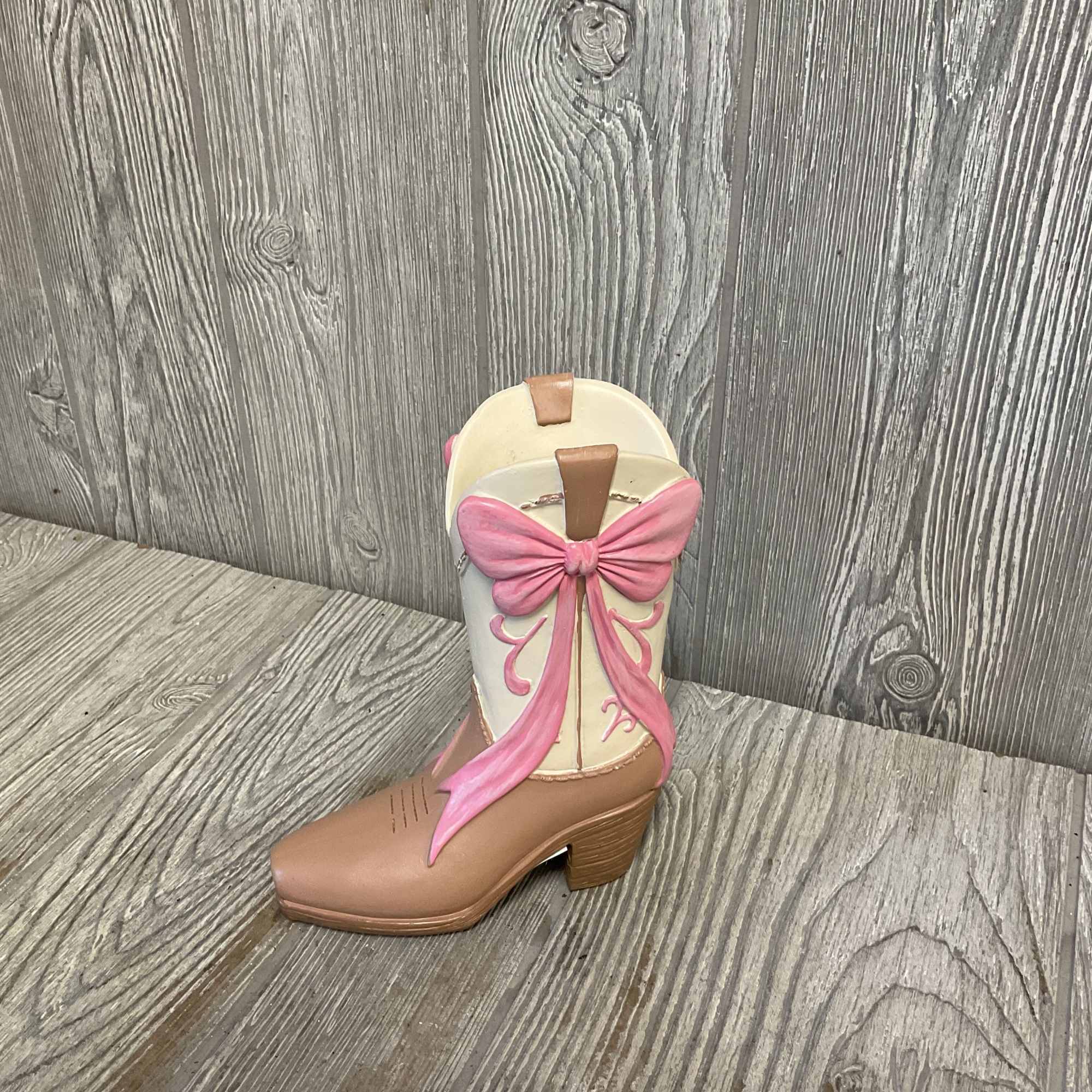 Fresh cut flowers arranged in a keepsake cowgirl boot container. Flowers and