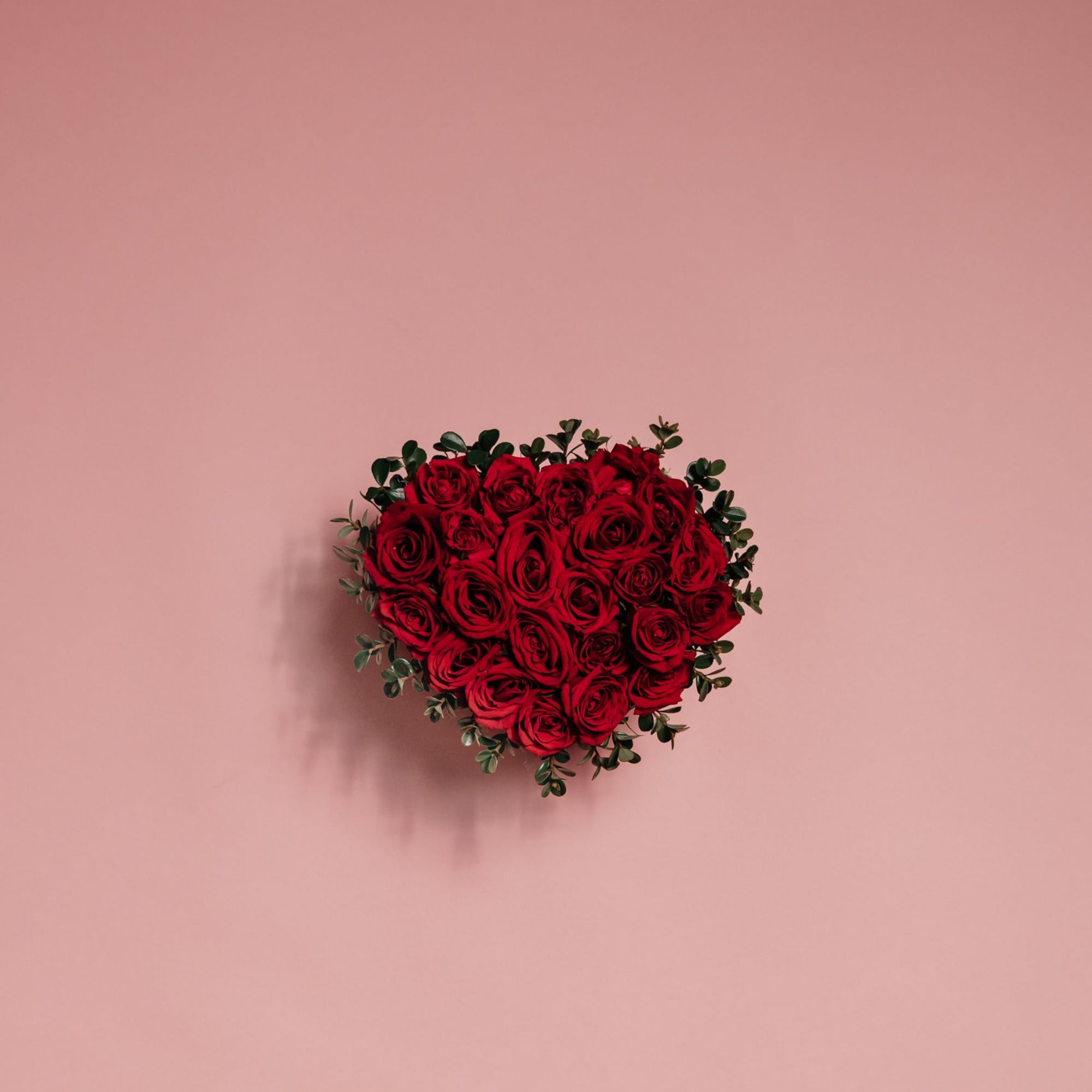 Scarlet Promise is a classic heart-shaped arrangement made of rich, velvety red