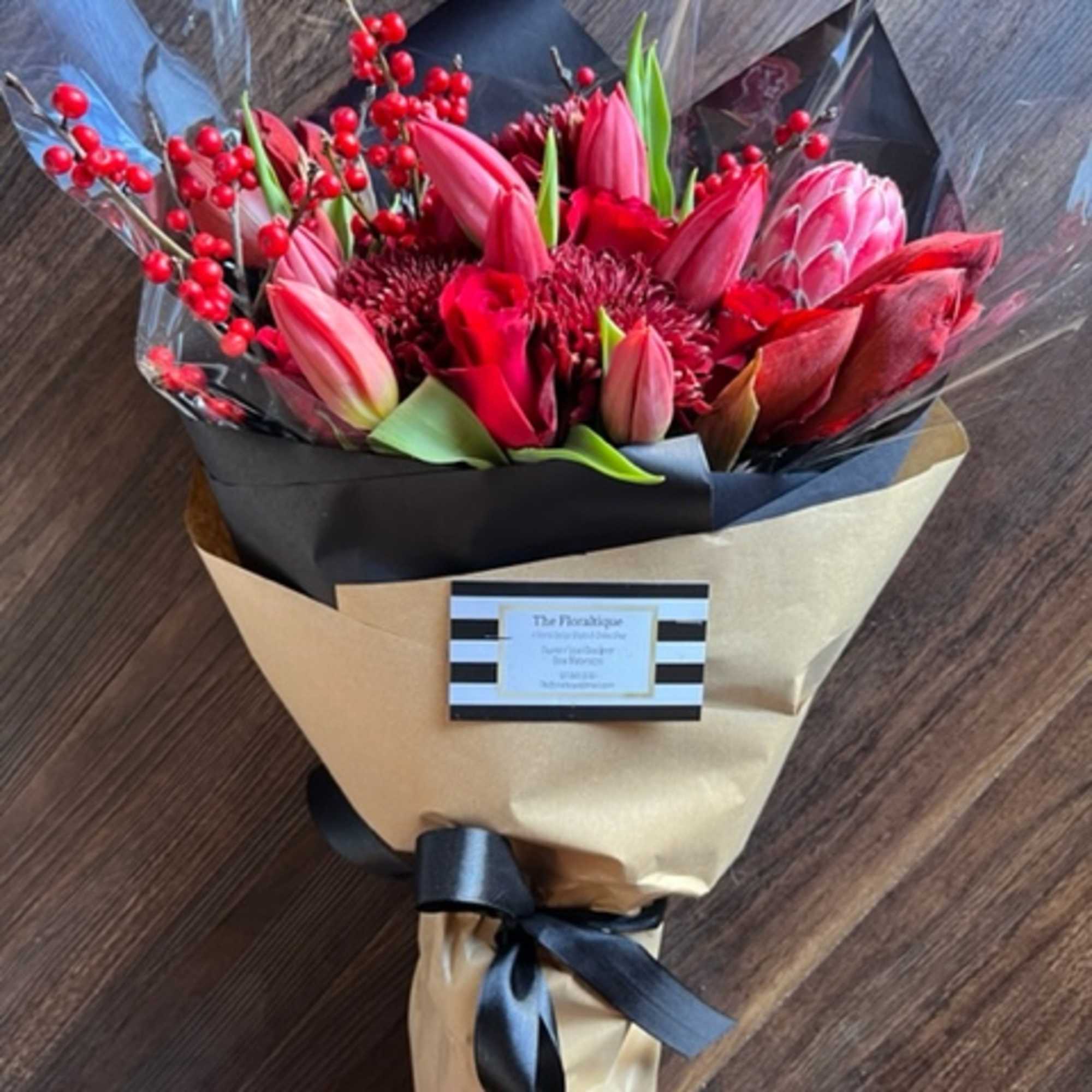 Send some love and cheer with this bold red bouquet of seasonal