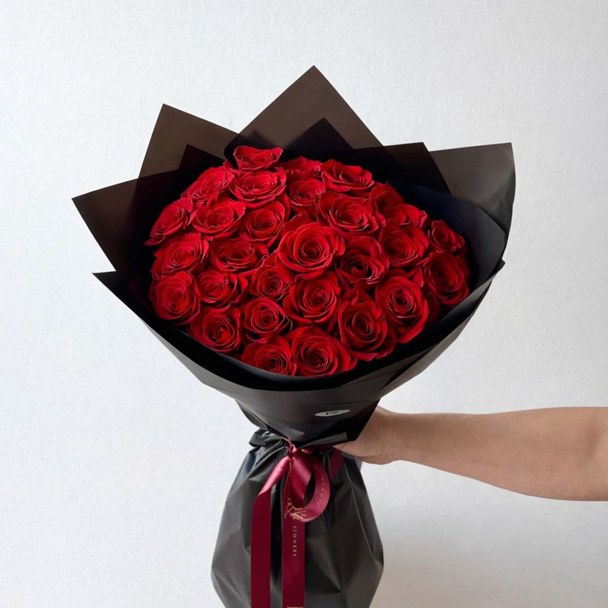 2 Dozen red roses in a bouquet