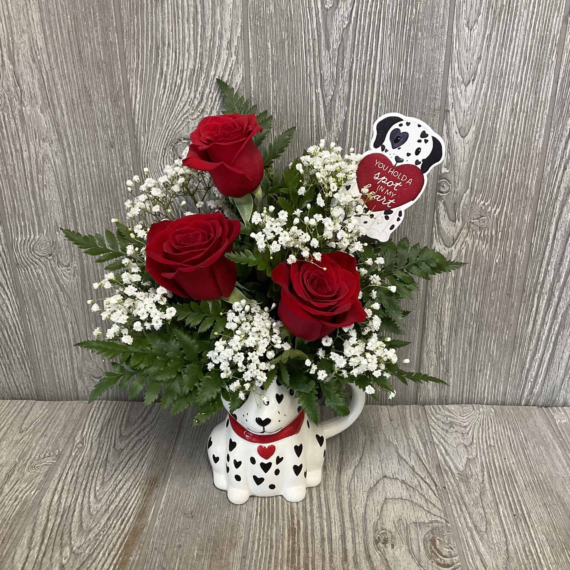 Beautiful fresh cut red roses arranged in an adorable keepsake ceramic Valentine&rsquo;s