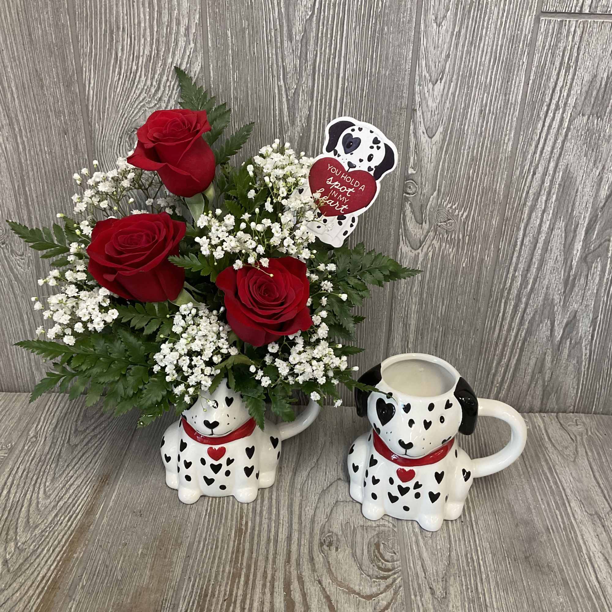 Beautiful fresh cut red roses arranged in an adorable keepsake ceramic Valentine&rsquo;s