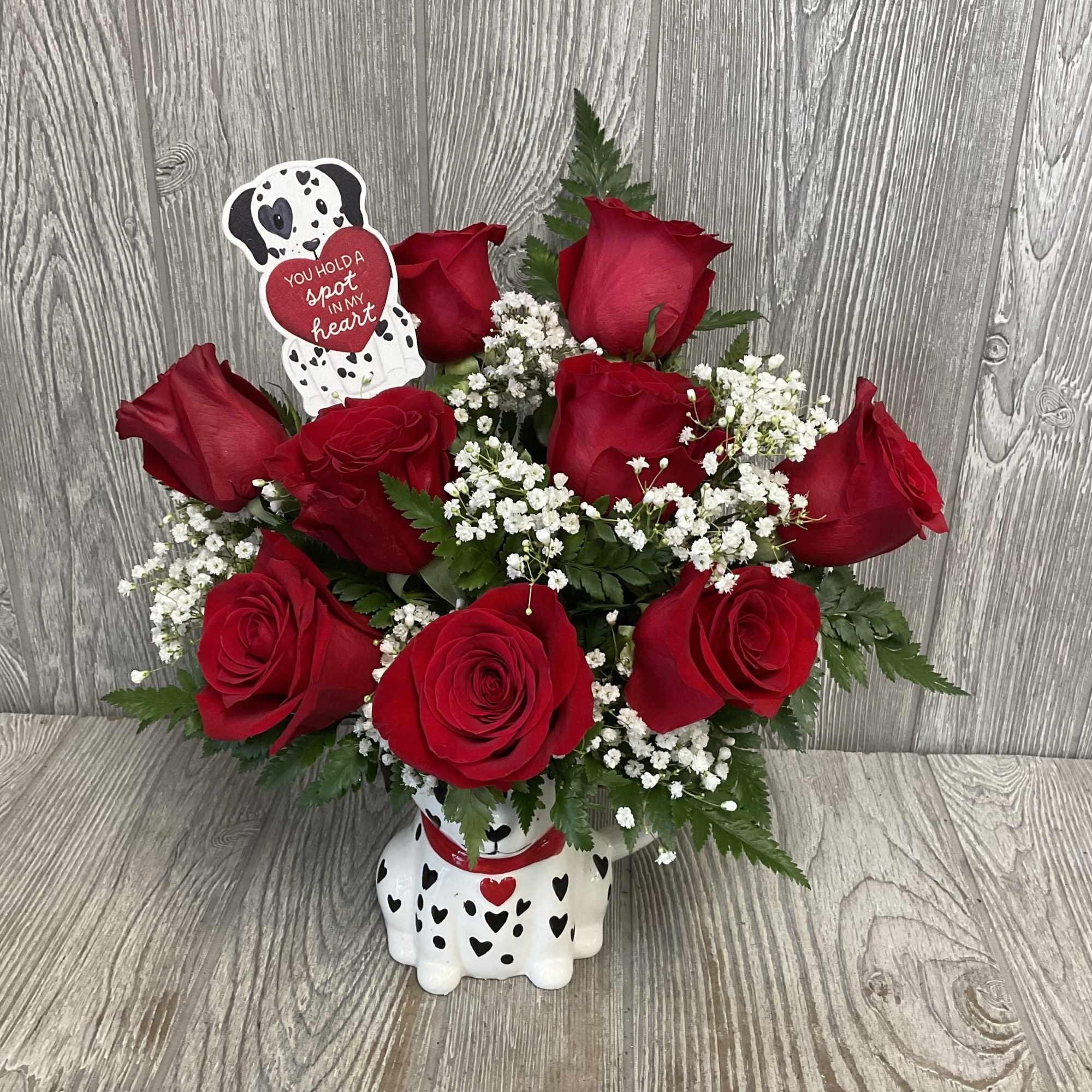 Beautiful fresh cut red roses arranged in an adorable keepsake ceramic Valentine&rsquo;s