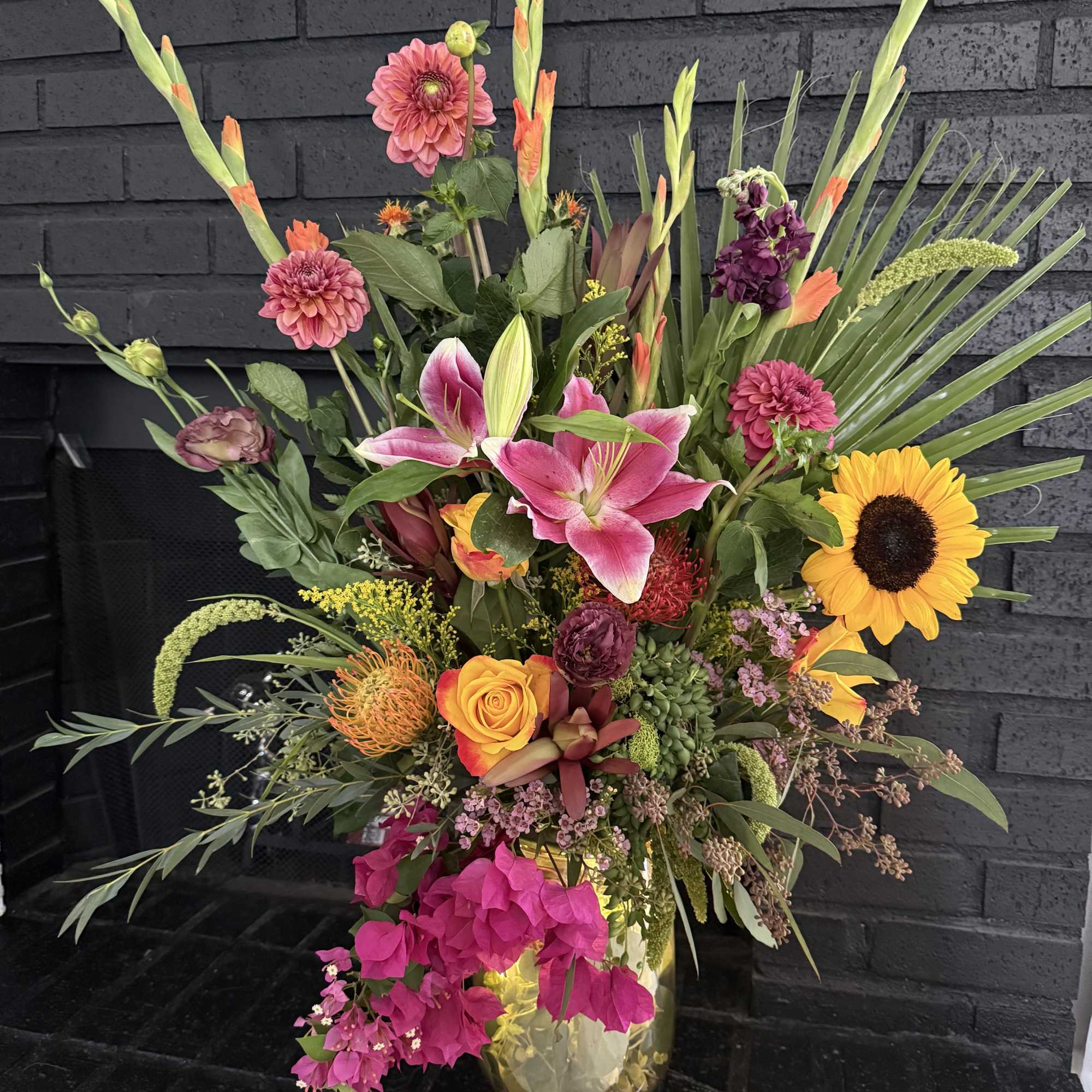 A stunning, one-of-a-kind floral arrangement that radiates elegance and vibrant charm. Designed