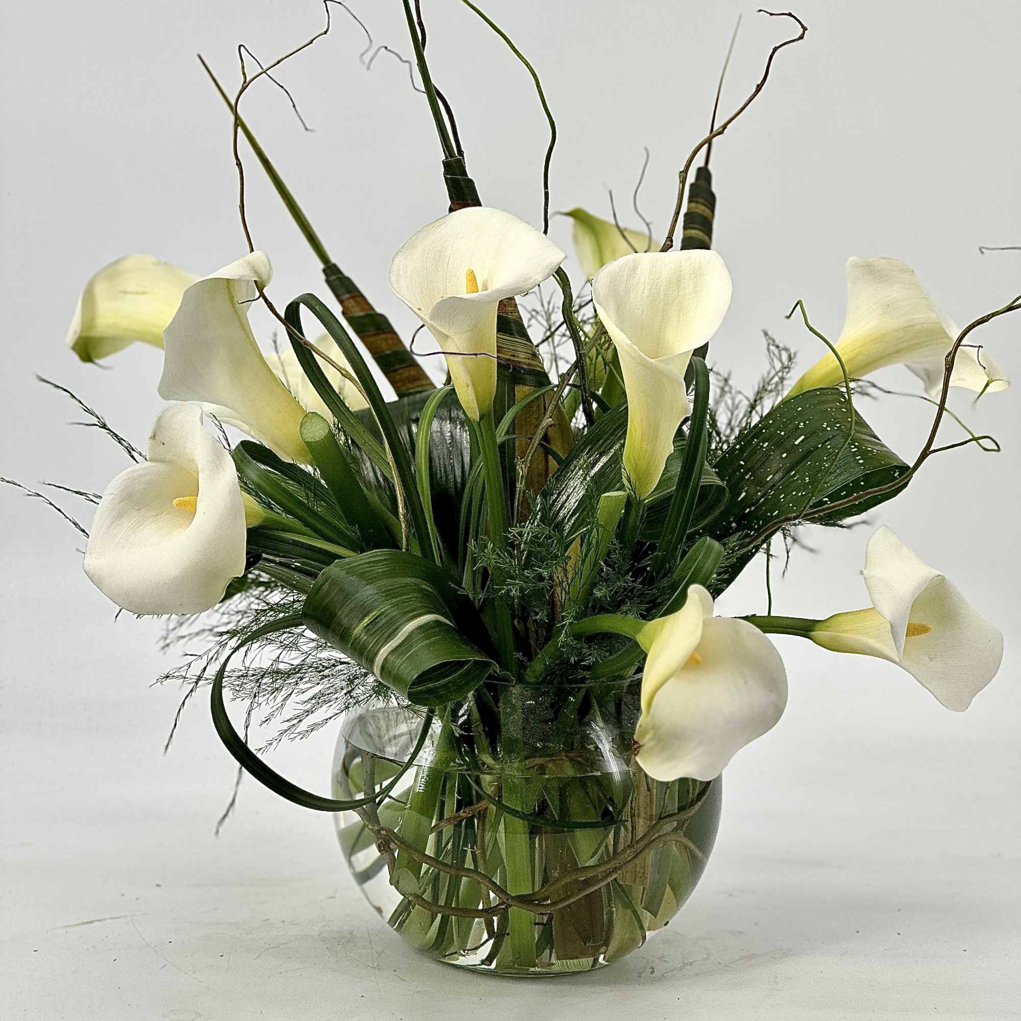 A very elegance ,luxurious fresh white calla lilies and rich seasonal greens