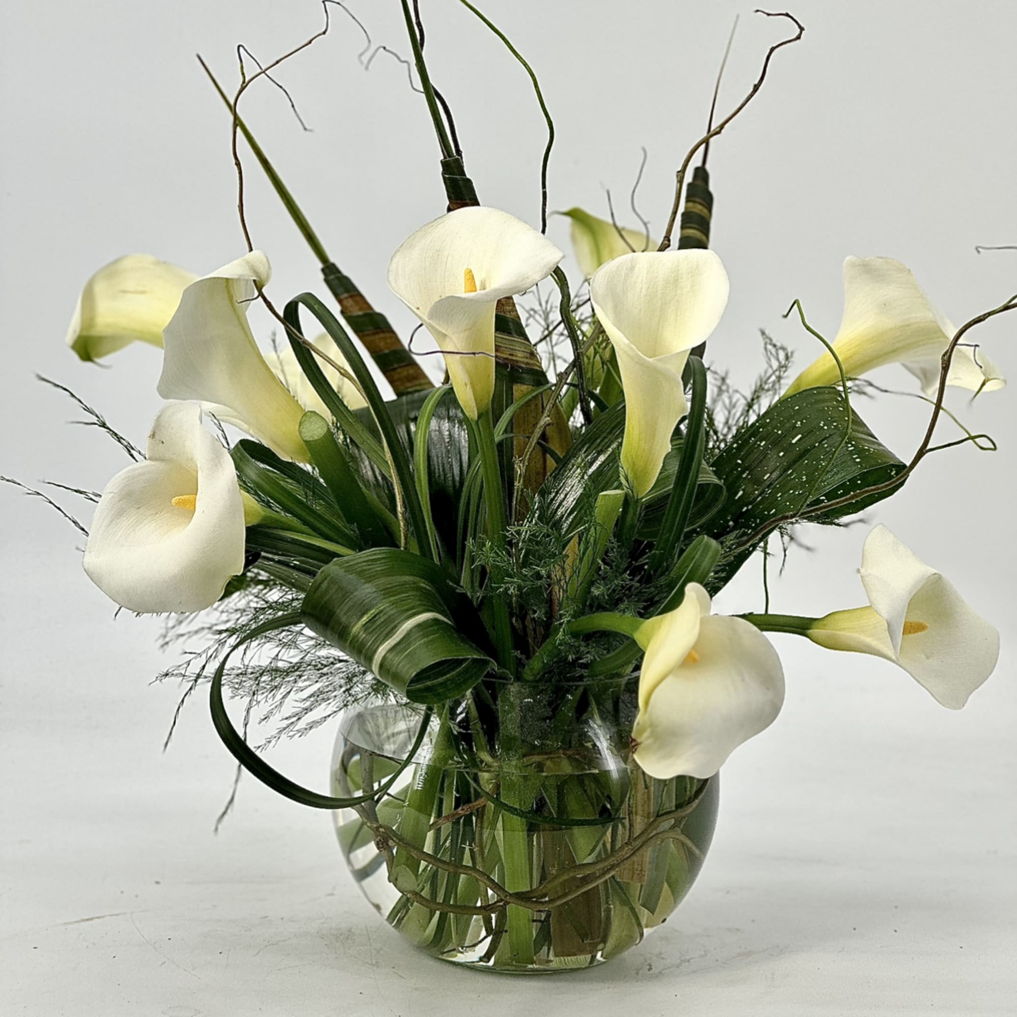 A very elegance ,luxurious fresh white calla lilies and rich seasonal greens