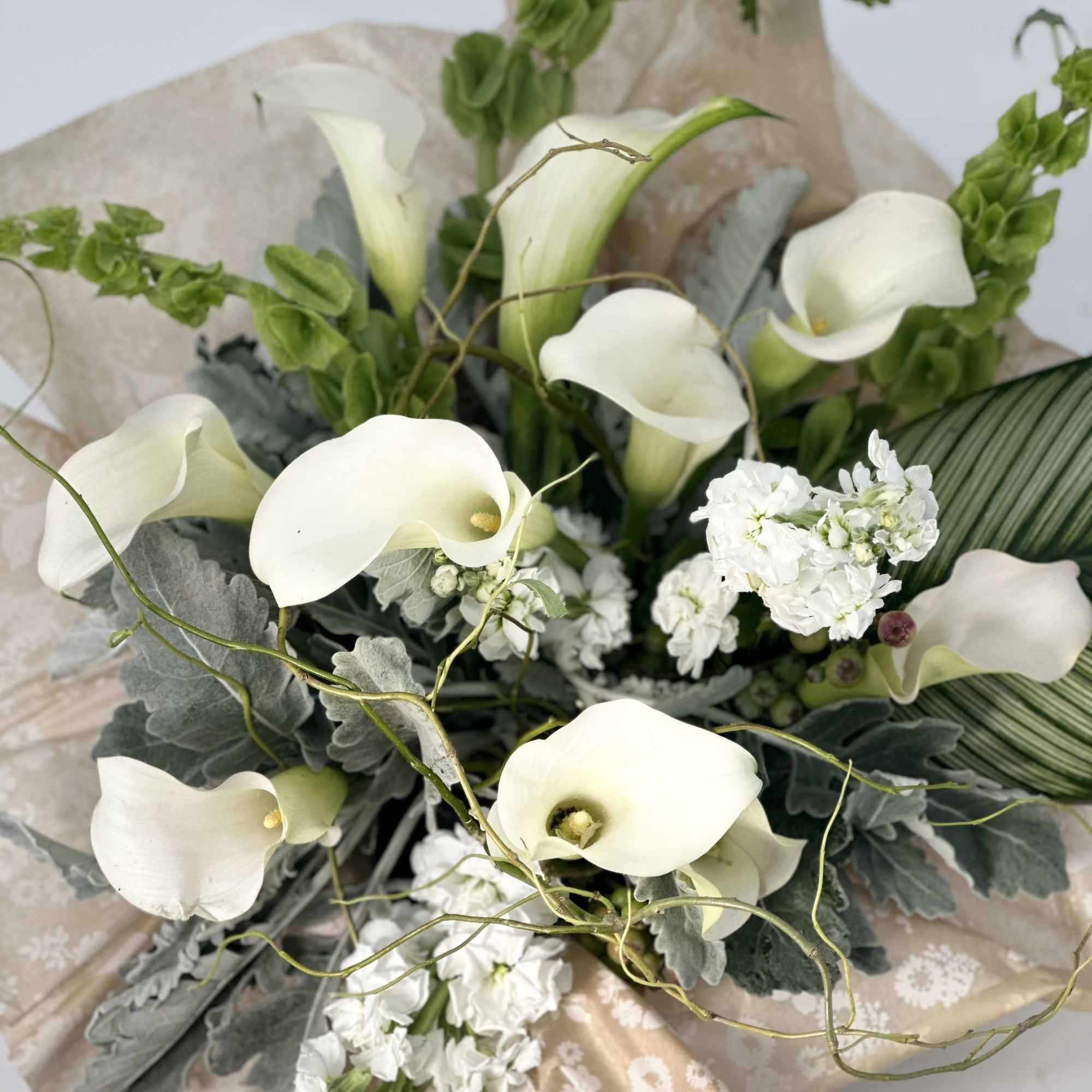 A very elegance ,luxurious fresh white calla lilies and rich seasonal greens