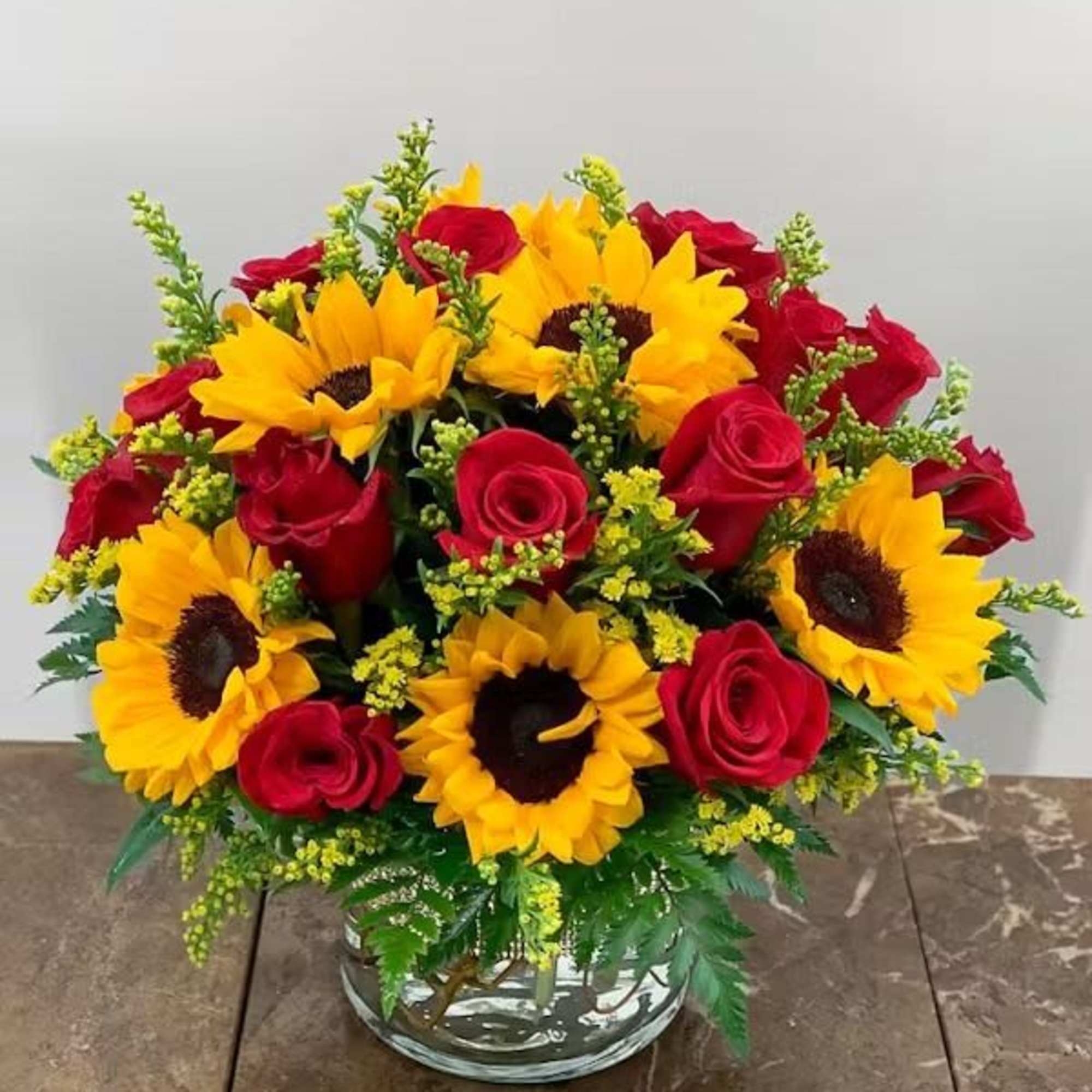 Brilliant Sunshine is a radiant vase arrangement designed to brighten any space