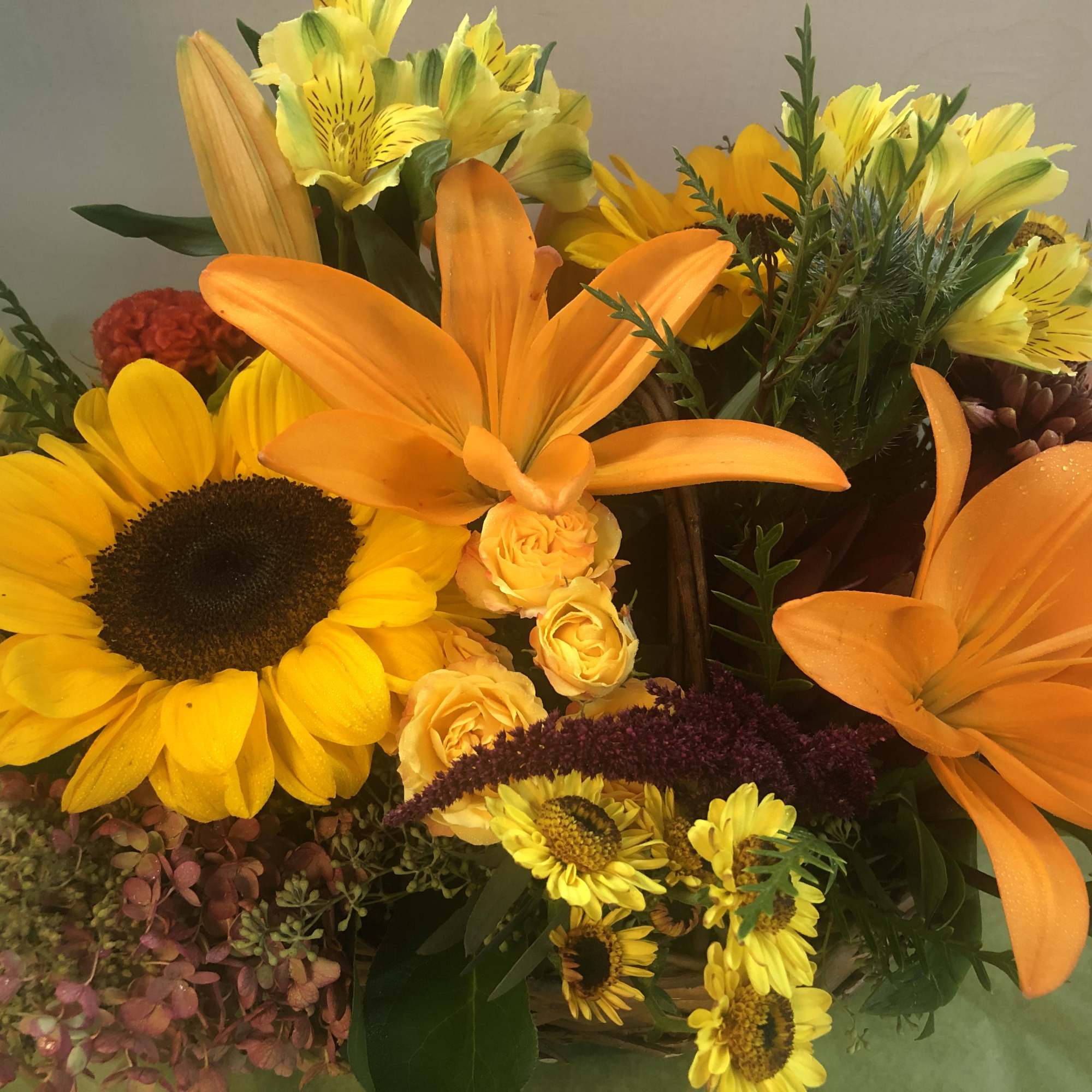 Sunflower, Lilies, Seasonal Flowers, Fancy green.

Note:   There are a variety