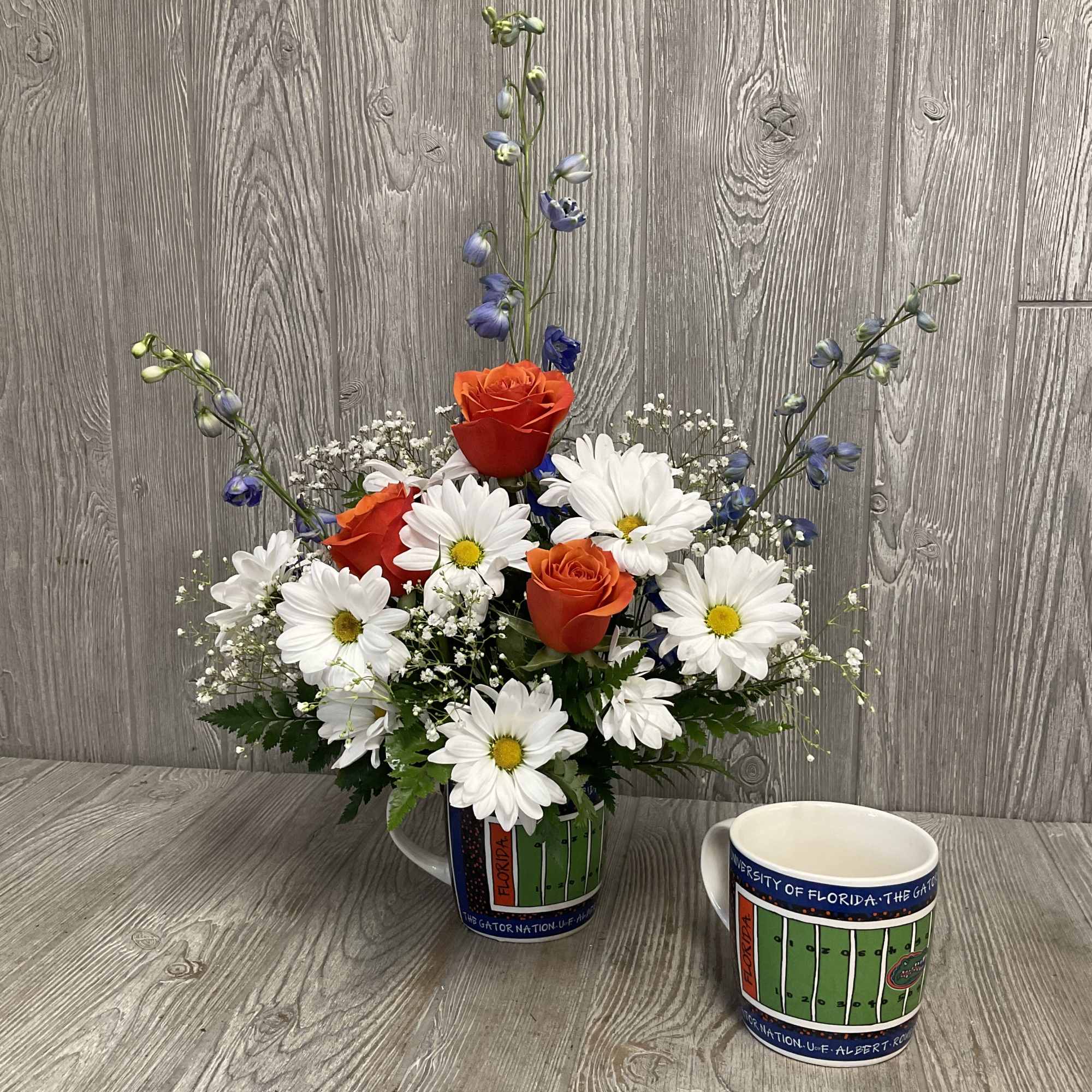 Gorgeous Gator themed fresh cut flowers arranged in a keepsake ceramic mug