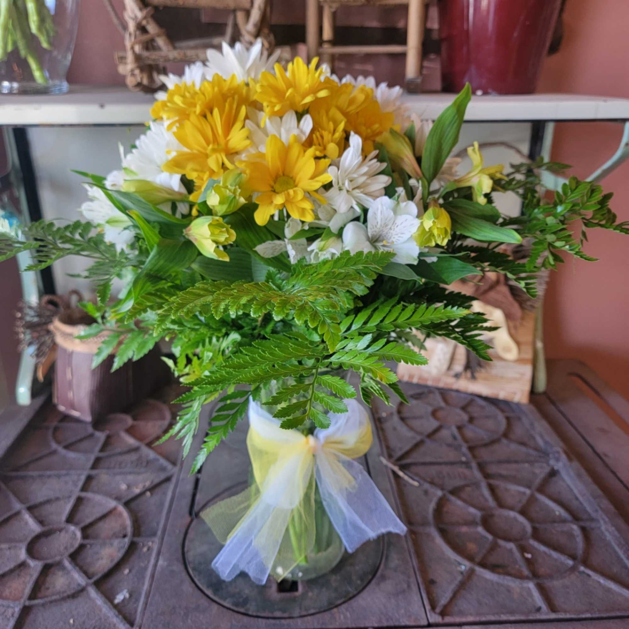 What could be sweeter than a cheerful glass vase filled with white