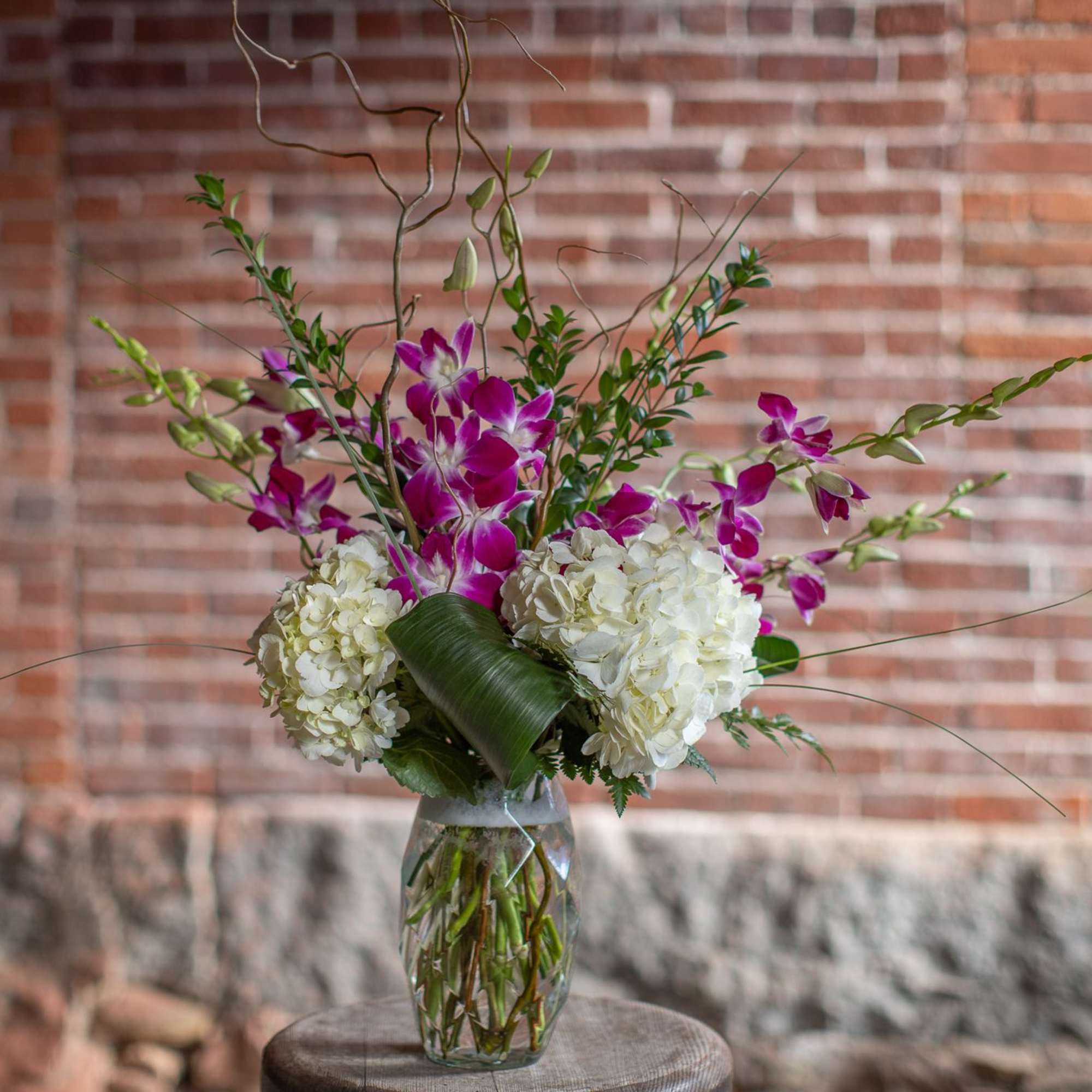A brilliant glass vase with marquis diamond pattern over flows with bright