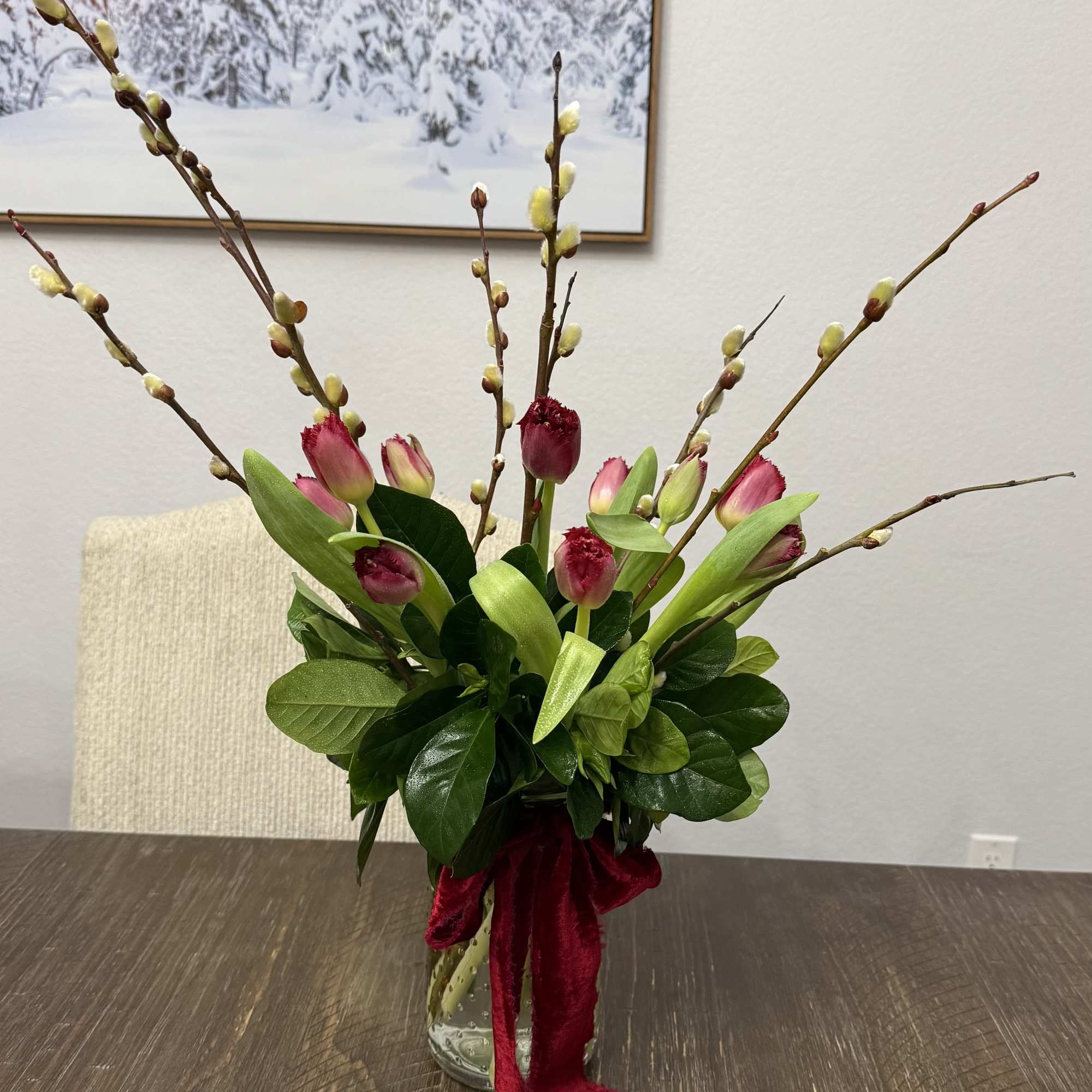 10 tulips in a mason jar with greens and pussy willow. 
