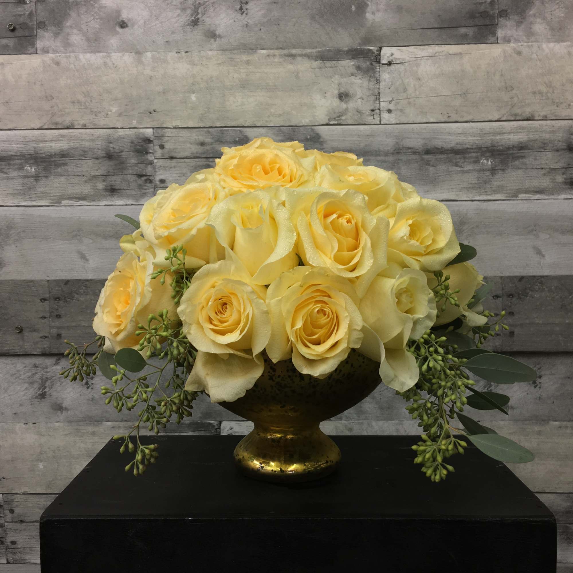 A lush cluster of  30 Red Roses in a Mercury Glass
