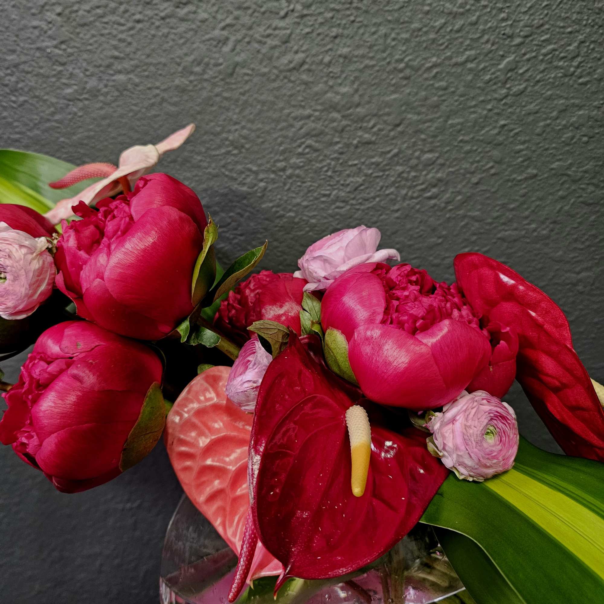 Peonies, Ranunculus, Anthurium OH MY! We make this arrangment with so much