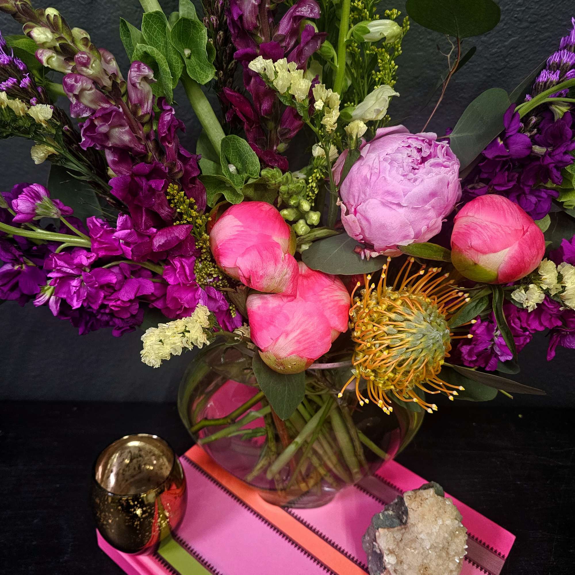 Indulge in the ultimate luxury with our Opulent Jewel-Toned Flower Arrangement. This