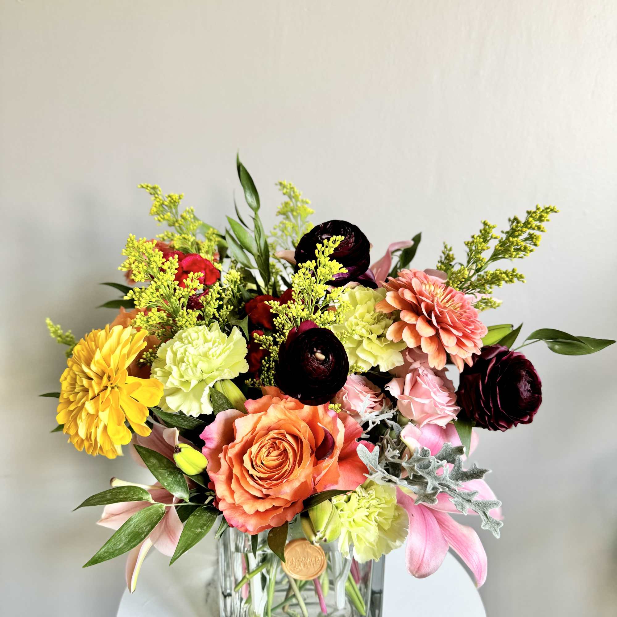 A one-of-a-kind arrangement designed with the freshest seasonal blooms, thoughtfully crafted to
