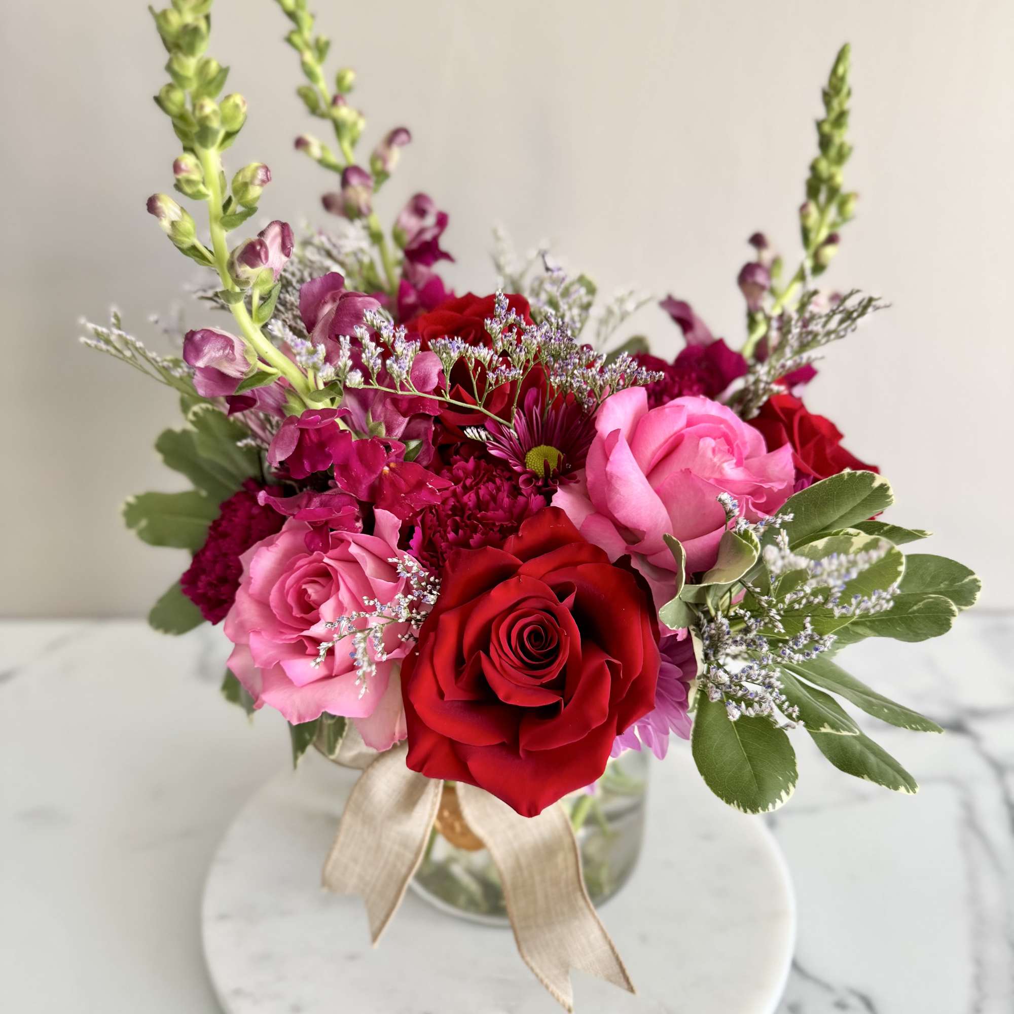 A one-of-a-kind arrangement designed with the freshest seasonal blooms, thoughtfully crafted to
