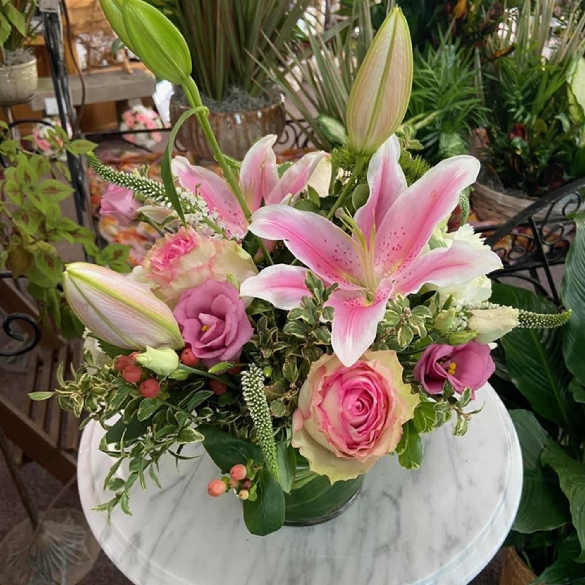 Fabulous mix of pink, white and green in low cylinder vase.