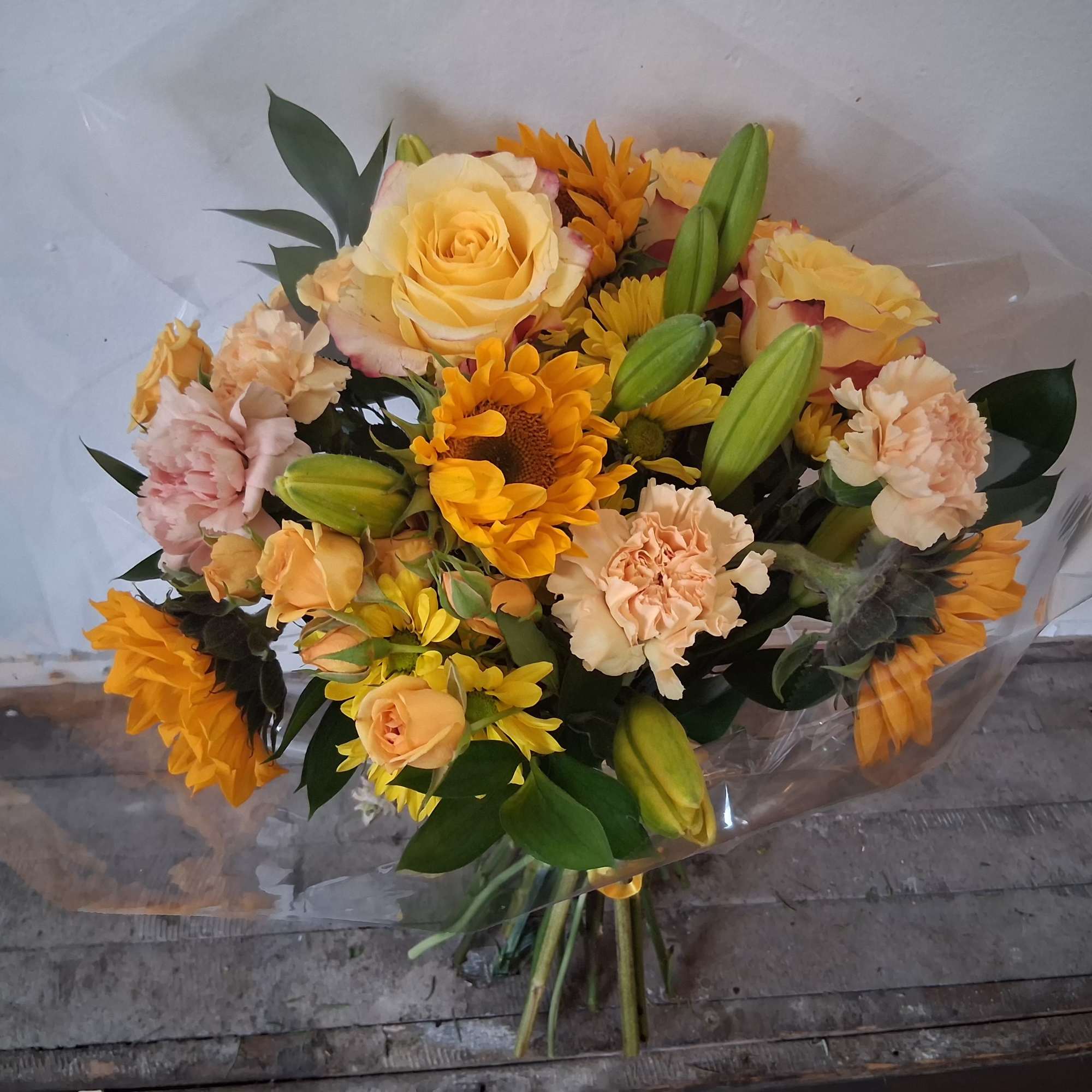 Amazingly sunny - yellow assortment of Asiatic lilies, variegated yellow/red roses, dusty