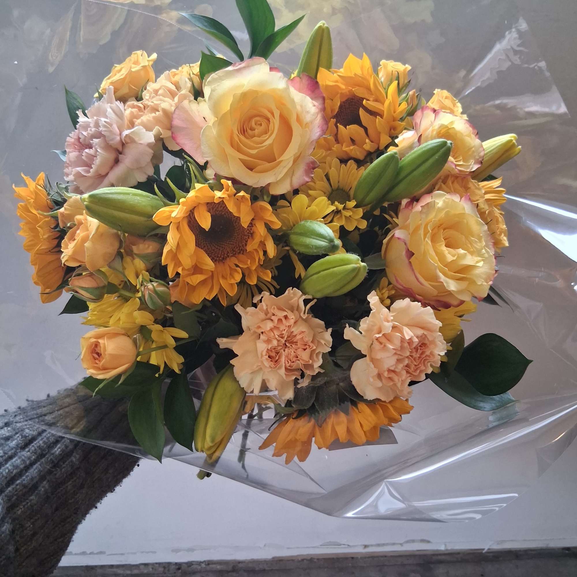 Amazingly sunny - yellow assortment of Asiatic lilies, variegated yellow/red roses, dusty