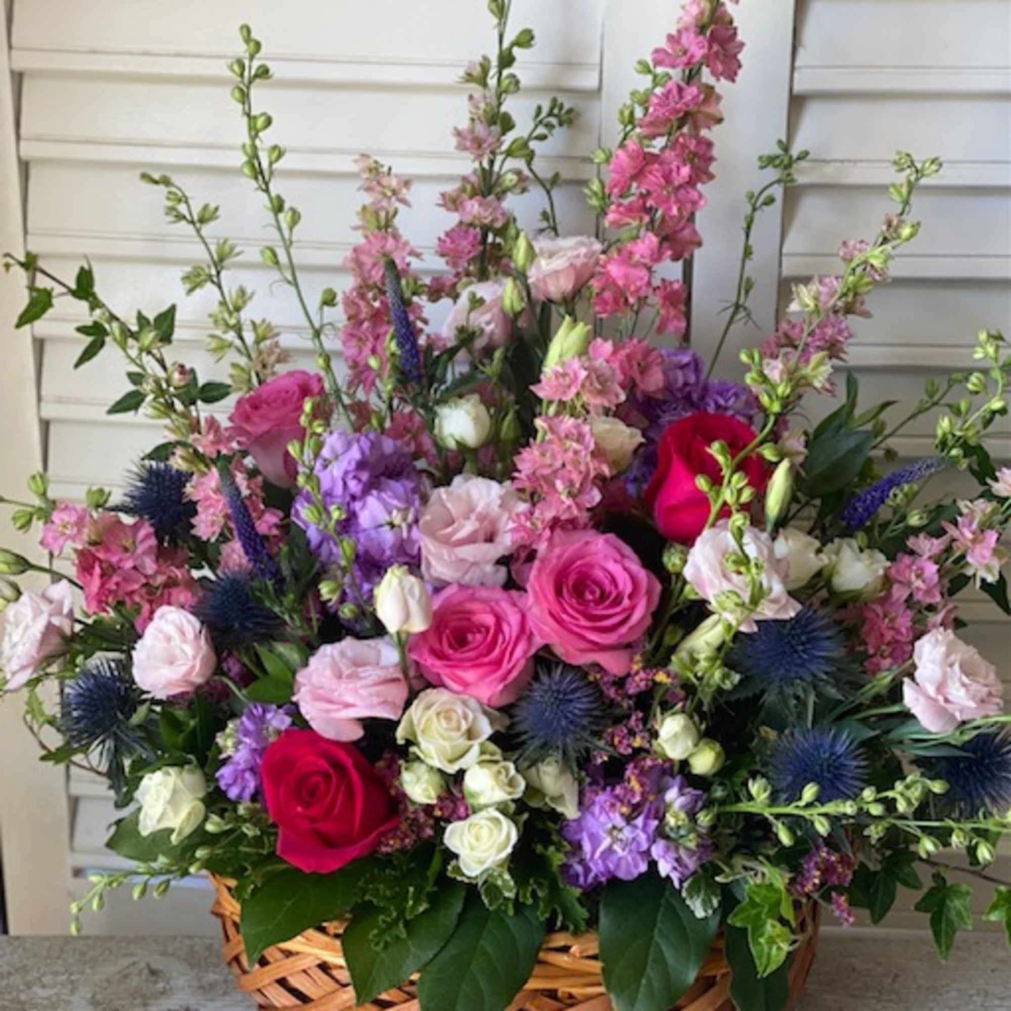Roses and assorted garden flowers in a beautiful wicker basket


