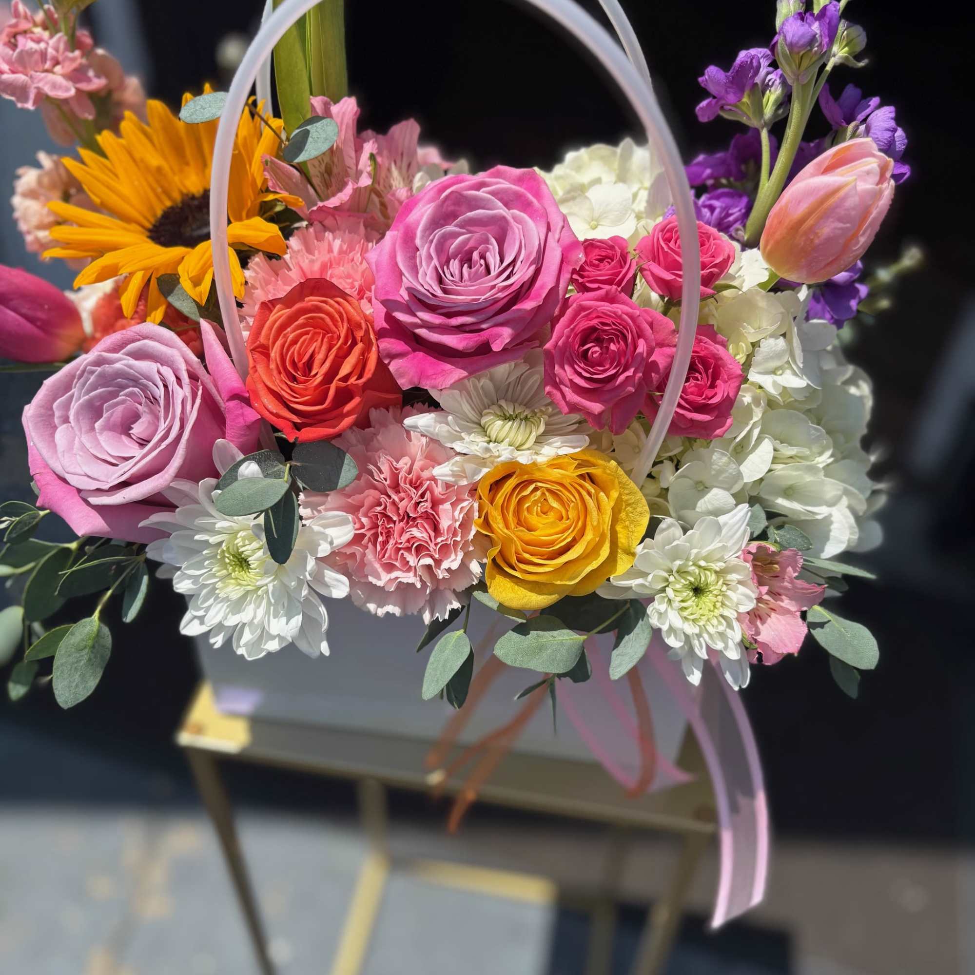 Our best-selling spring tote bouquet is gathered with a mix of vibrant