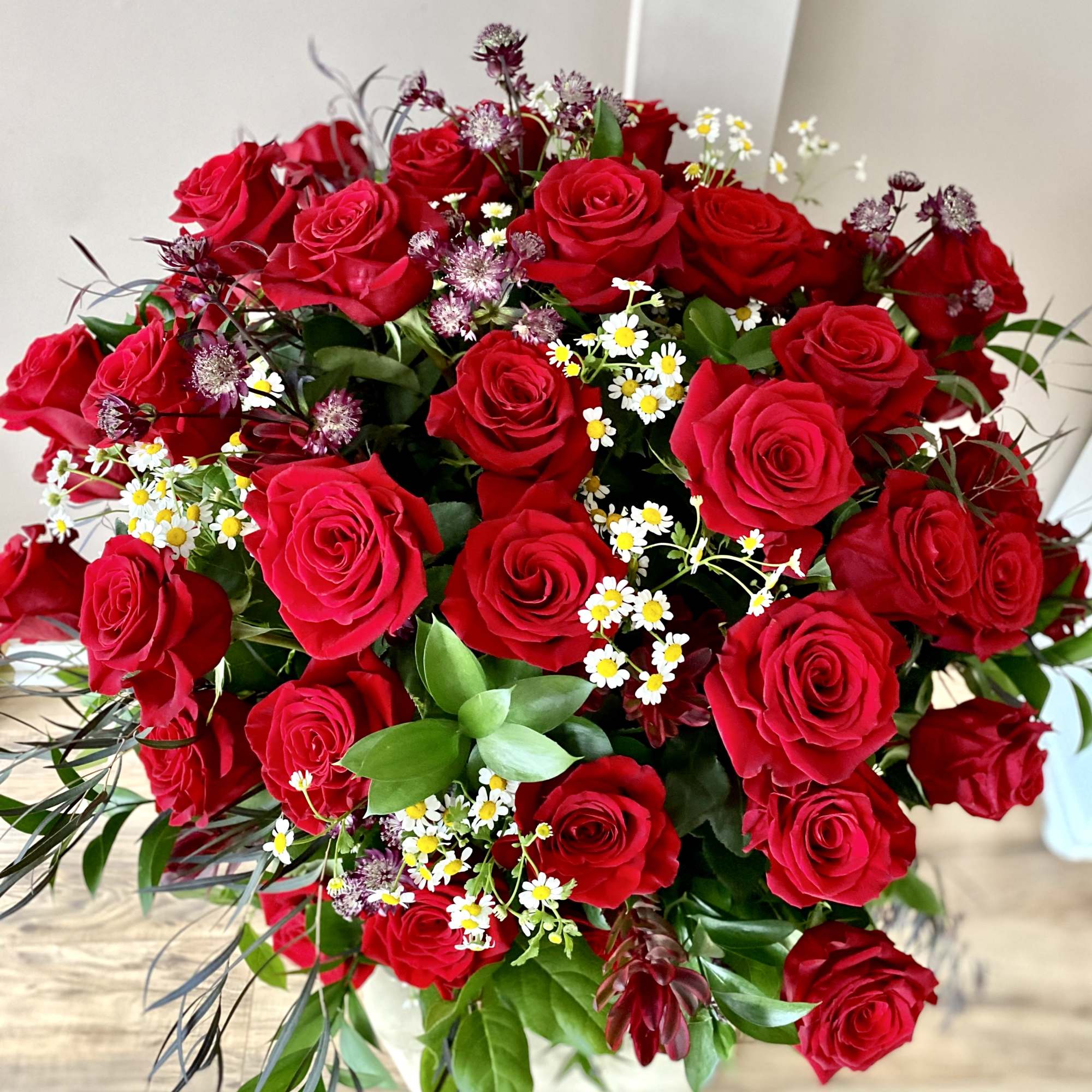 50 red roses!!! It's one-of-a king arrangement! Huge, impressive, bold... just WOW!