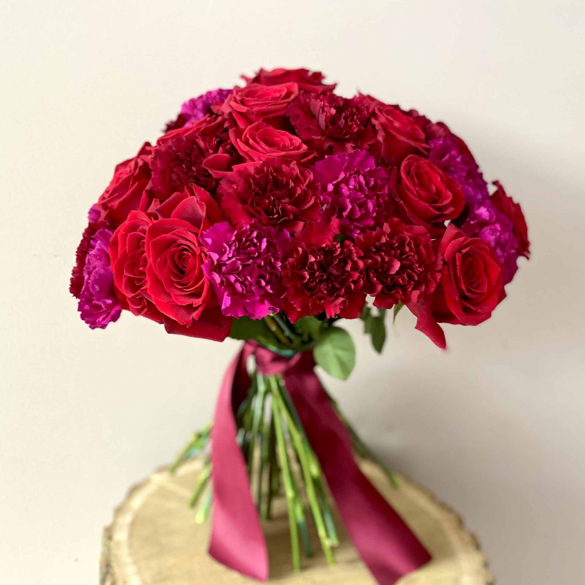 Lush, elegant, and unique bouquet will definitely make Her smile! 
The red