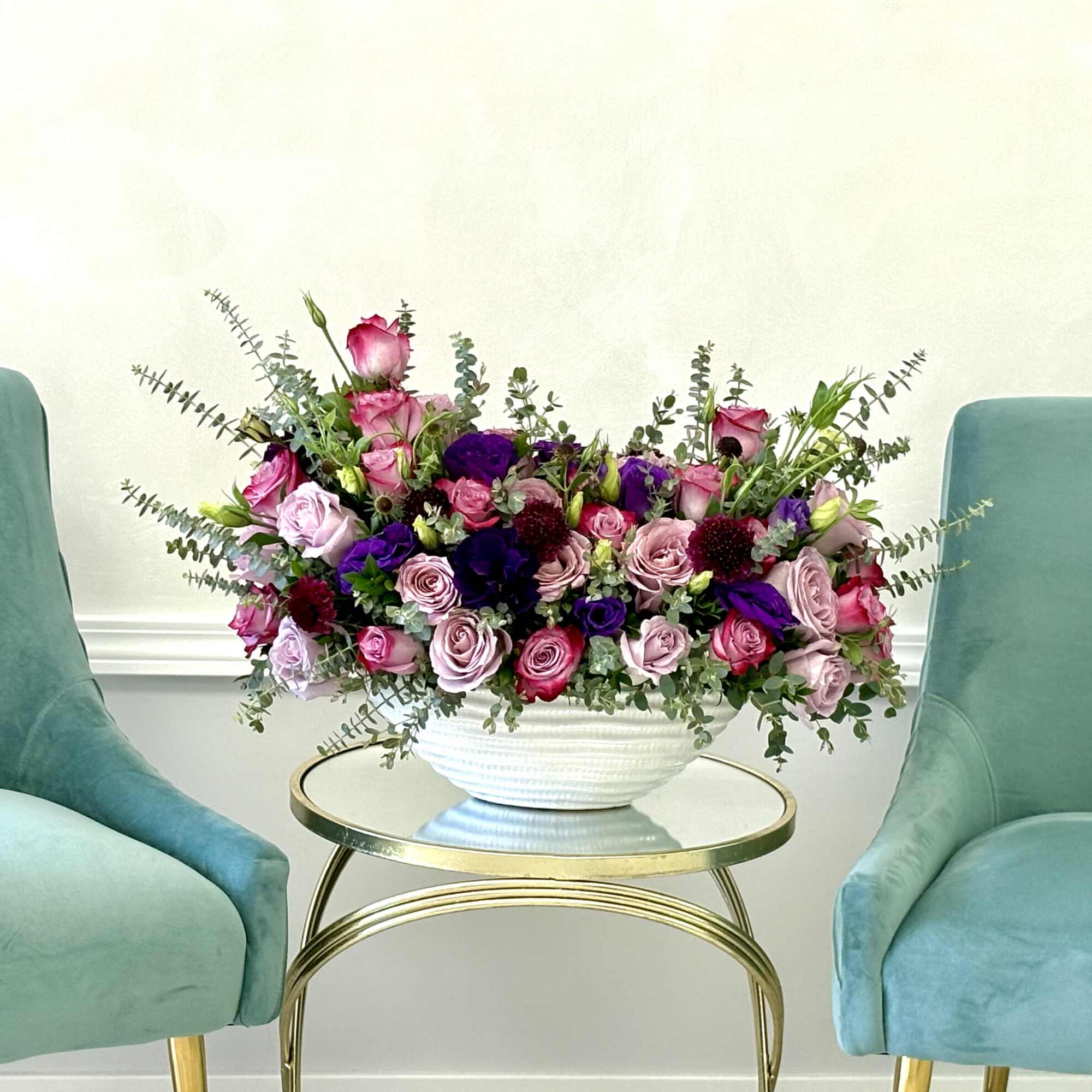 This garden-inspired design blends classic lavender roses with playful pops of raspberry