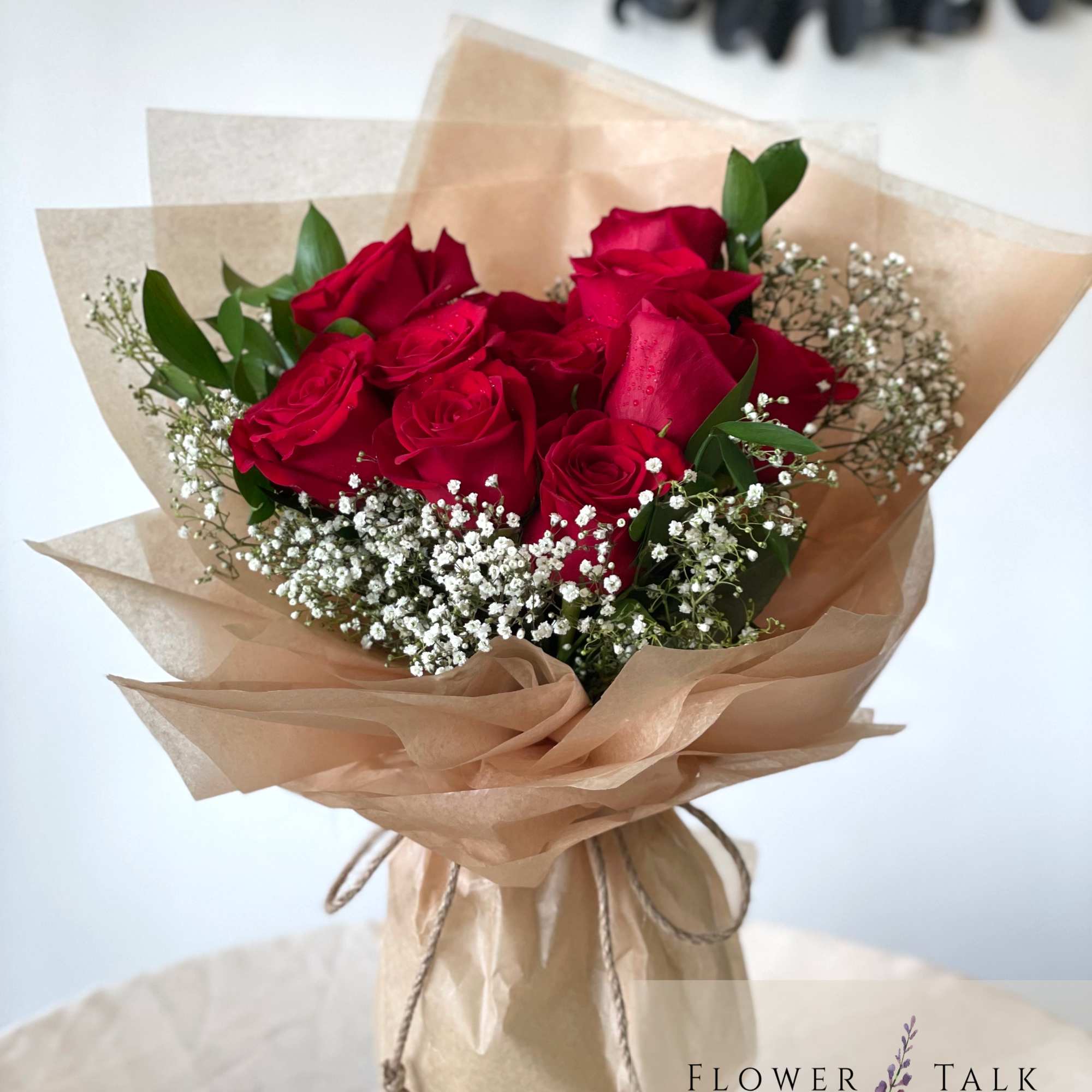 Dozen red roses tied in a hand bouquet
This bouquet does not come