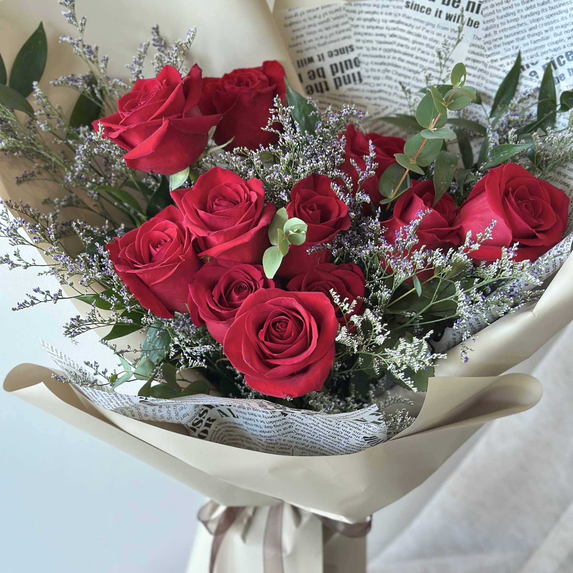 Dozen red roses tied in a hand bouquet
This bouquet does not come