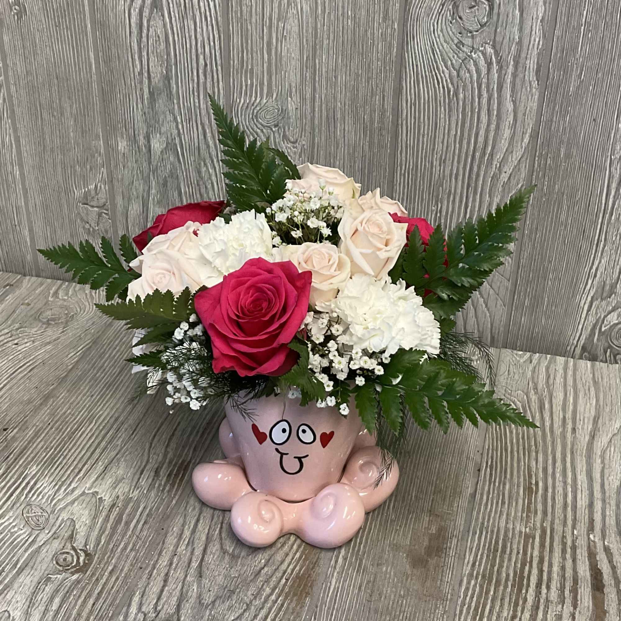 A cute Valentine&rsquo;s arrangement in a keepsake ceramic octopus vase. Colors and