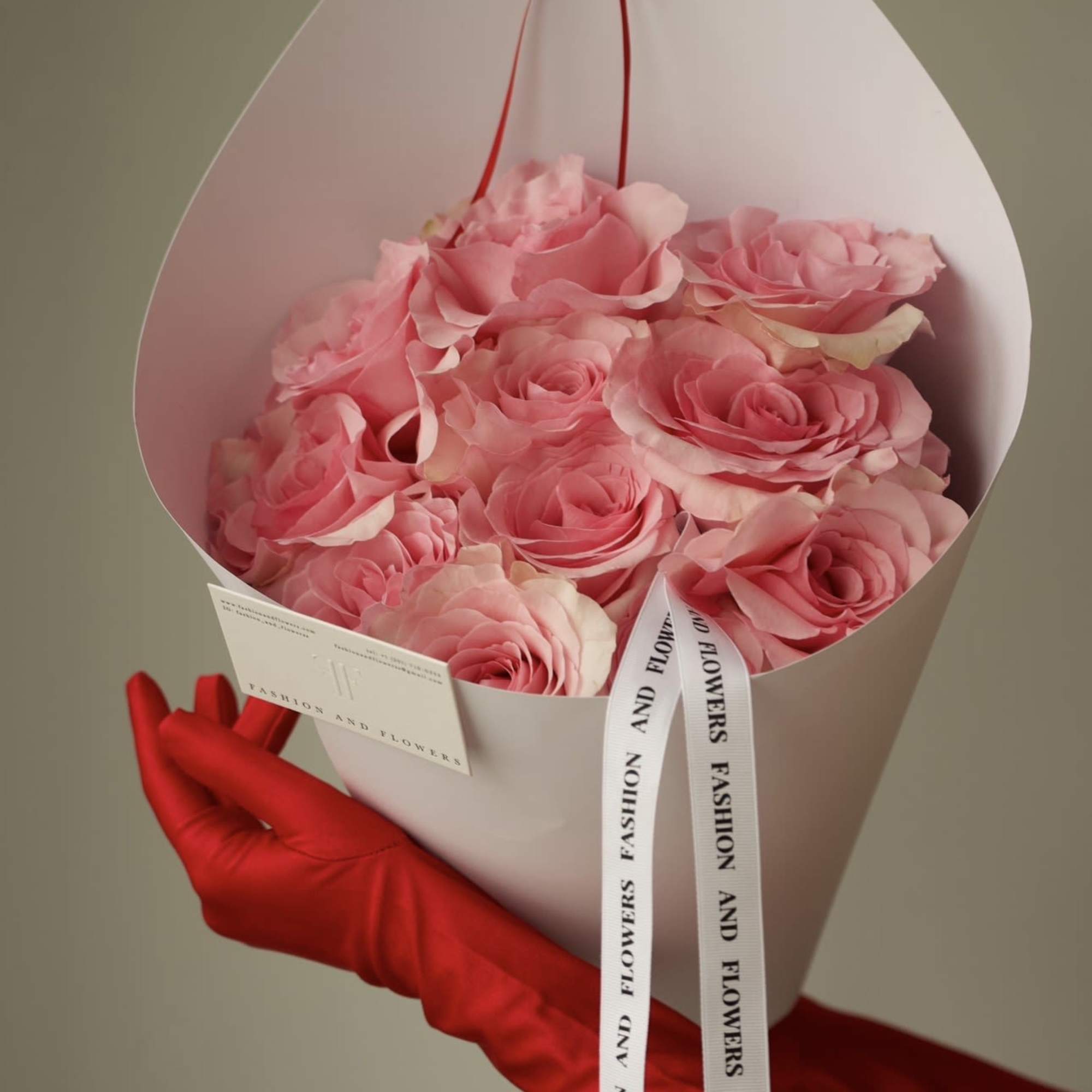 A delicate bouquet of fresh pink roses, thoughtfully arranged in a clean
