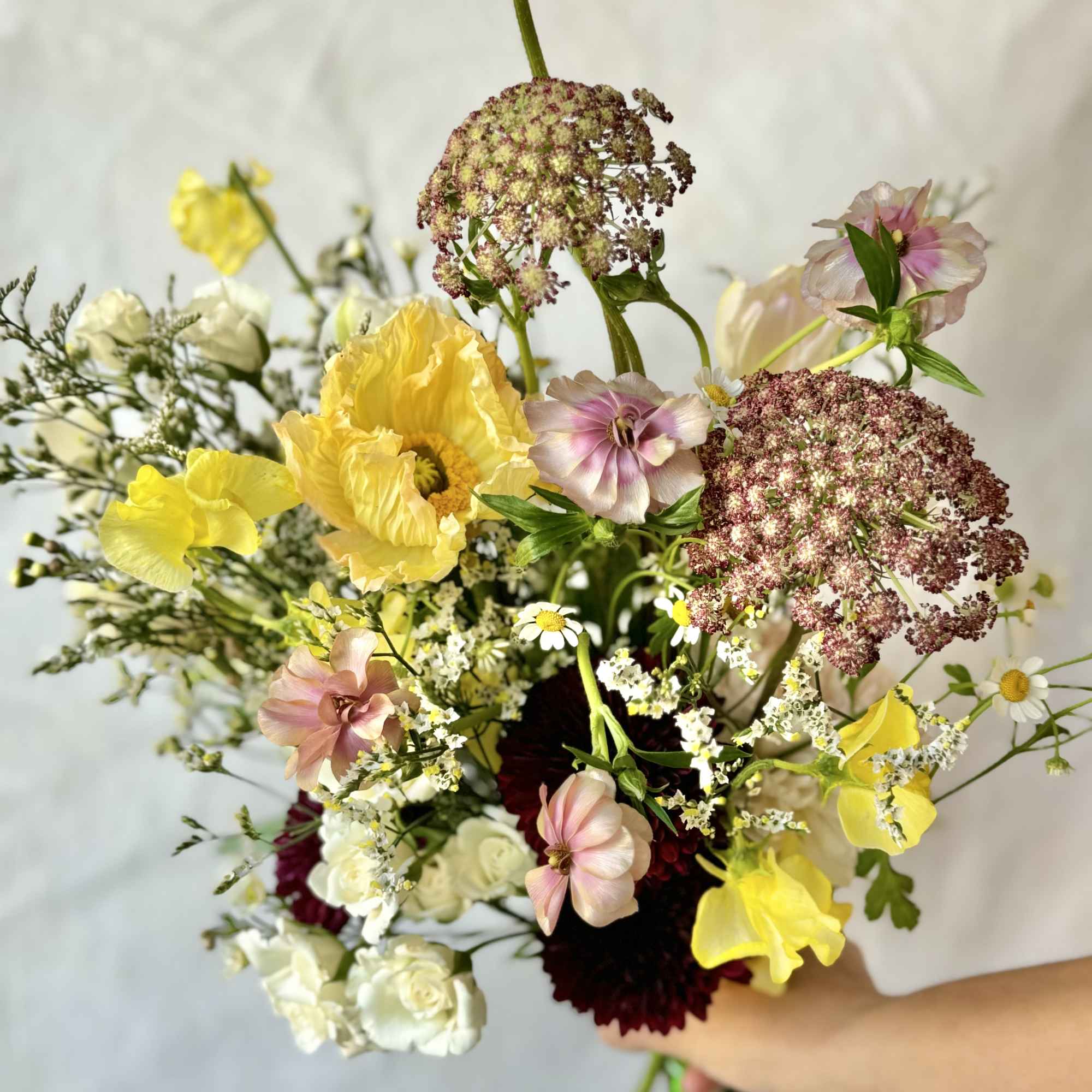 These petite bouquets are thoughtfully arranged with fresh, seasonal blooms chosen by