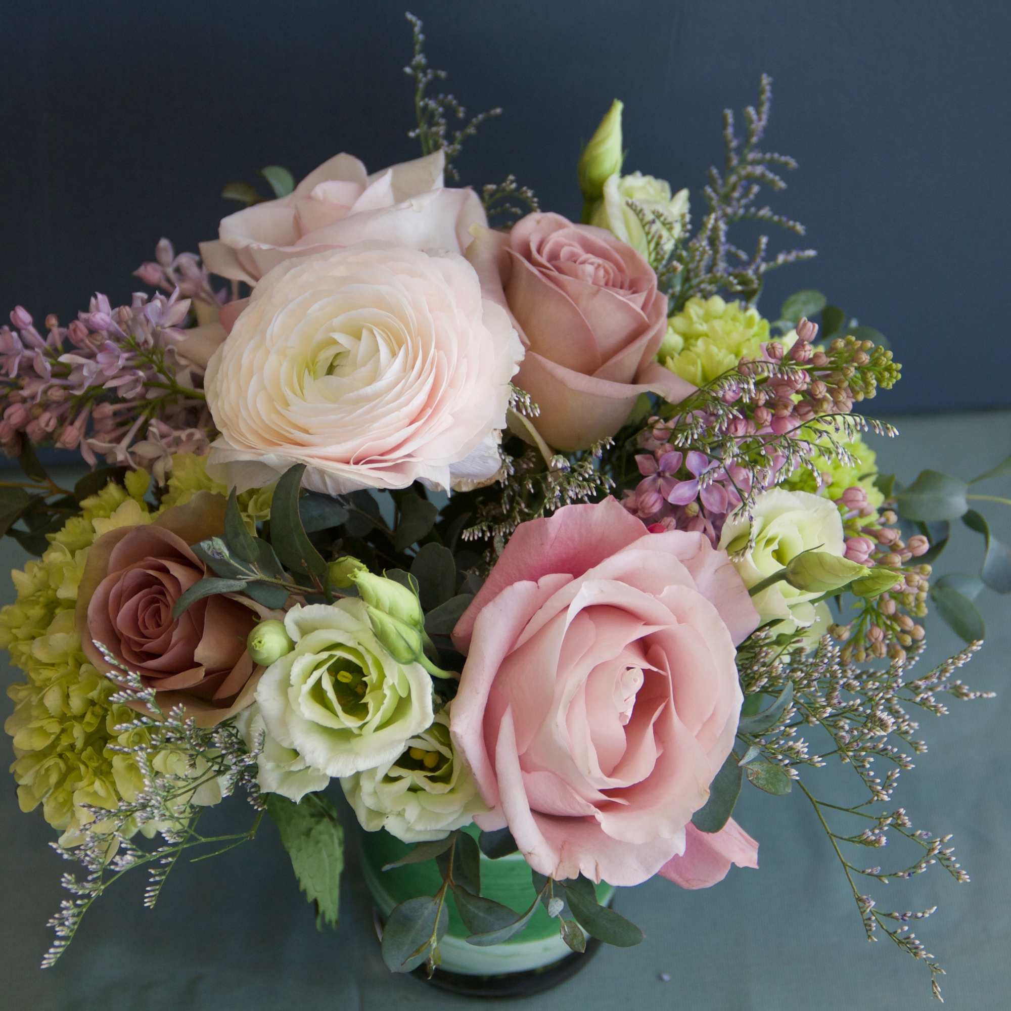We will put together a lush arrangement in a lovely color palette