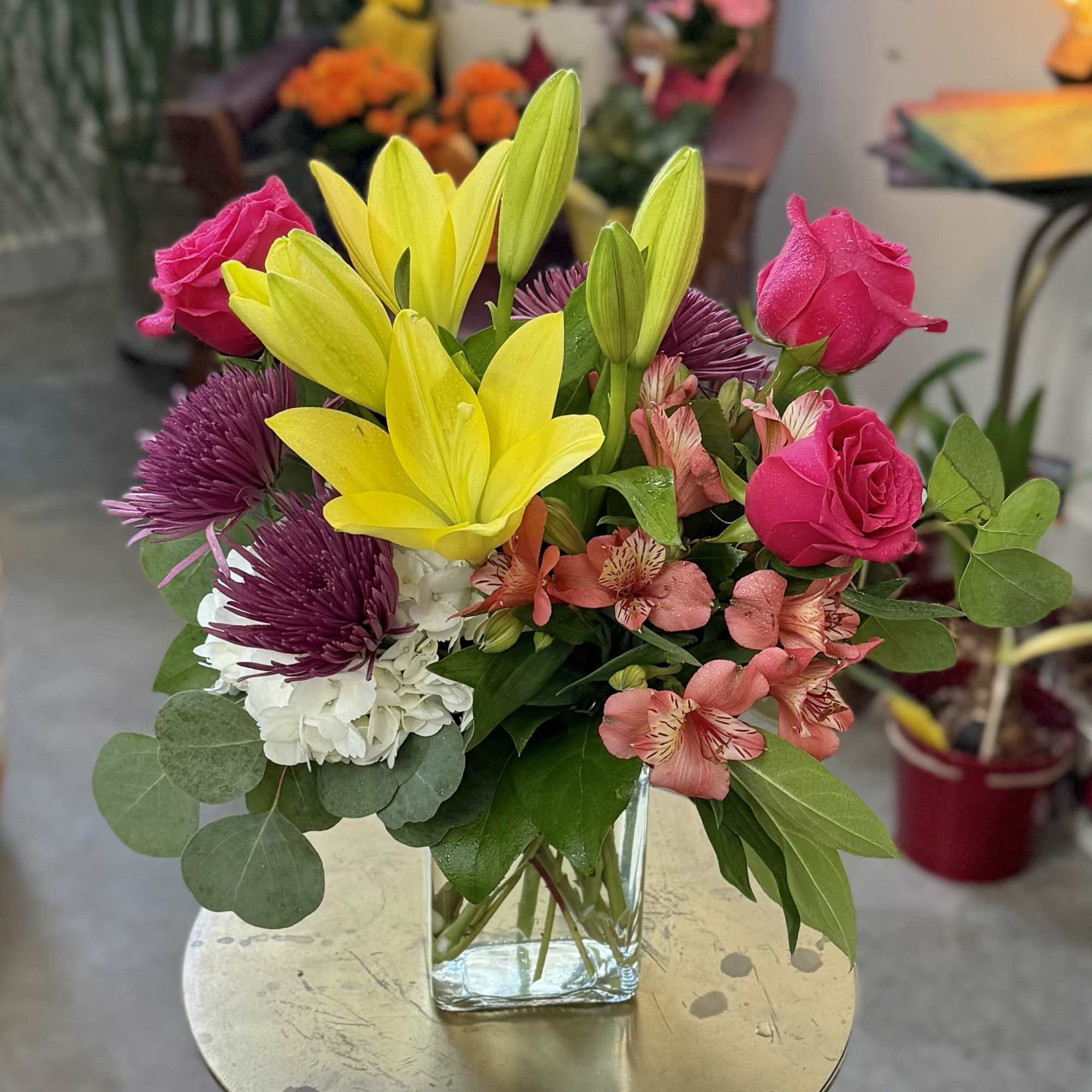 Lovely chrysanthemums, brilliant roses, lilies and hydrangea, accented with premium greens. The