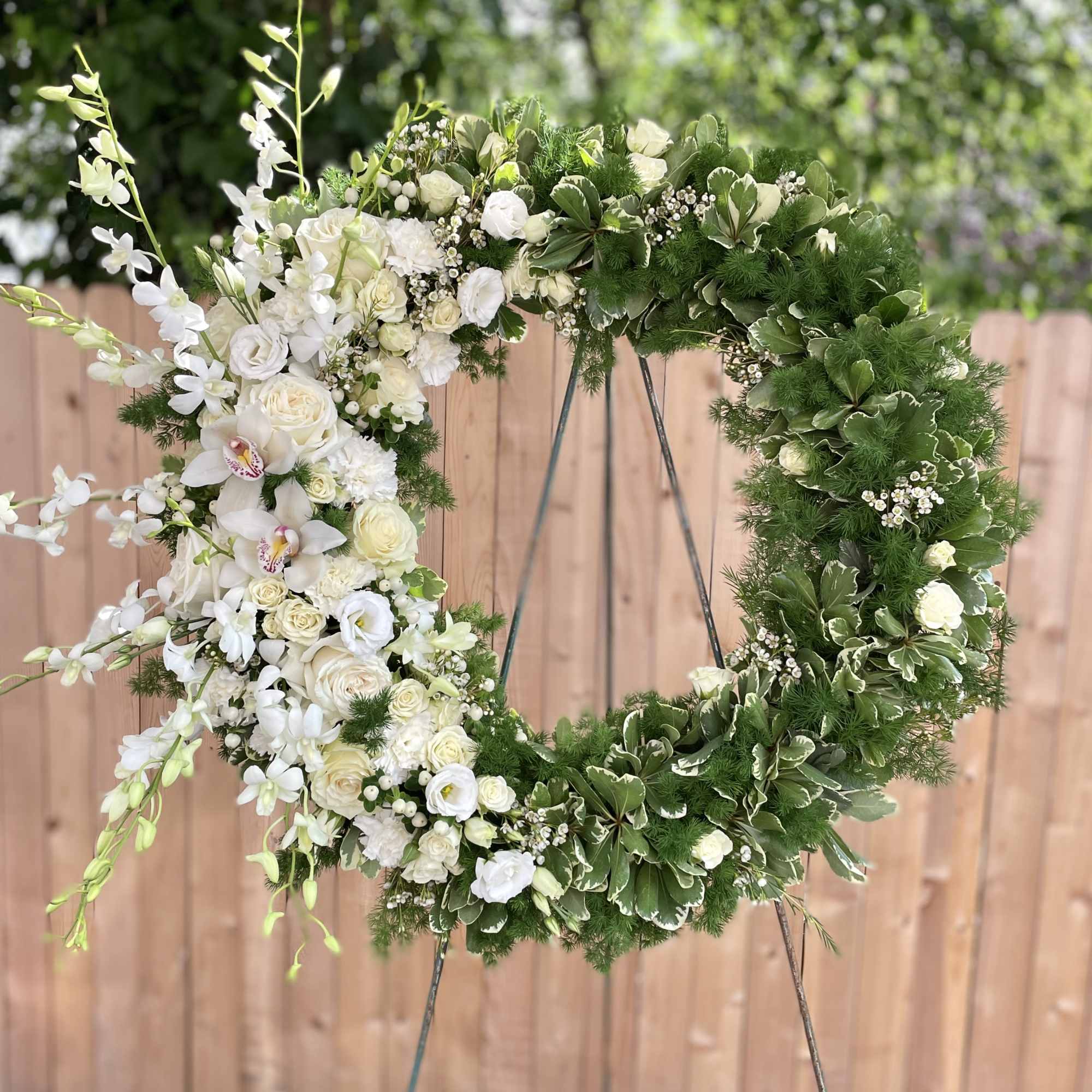 DELUXE SIZE PICTURED. Honor a life with quiet elegance through our Tranquil