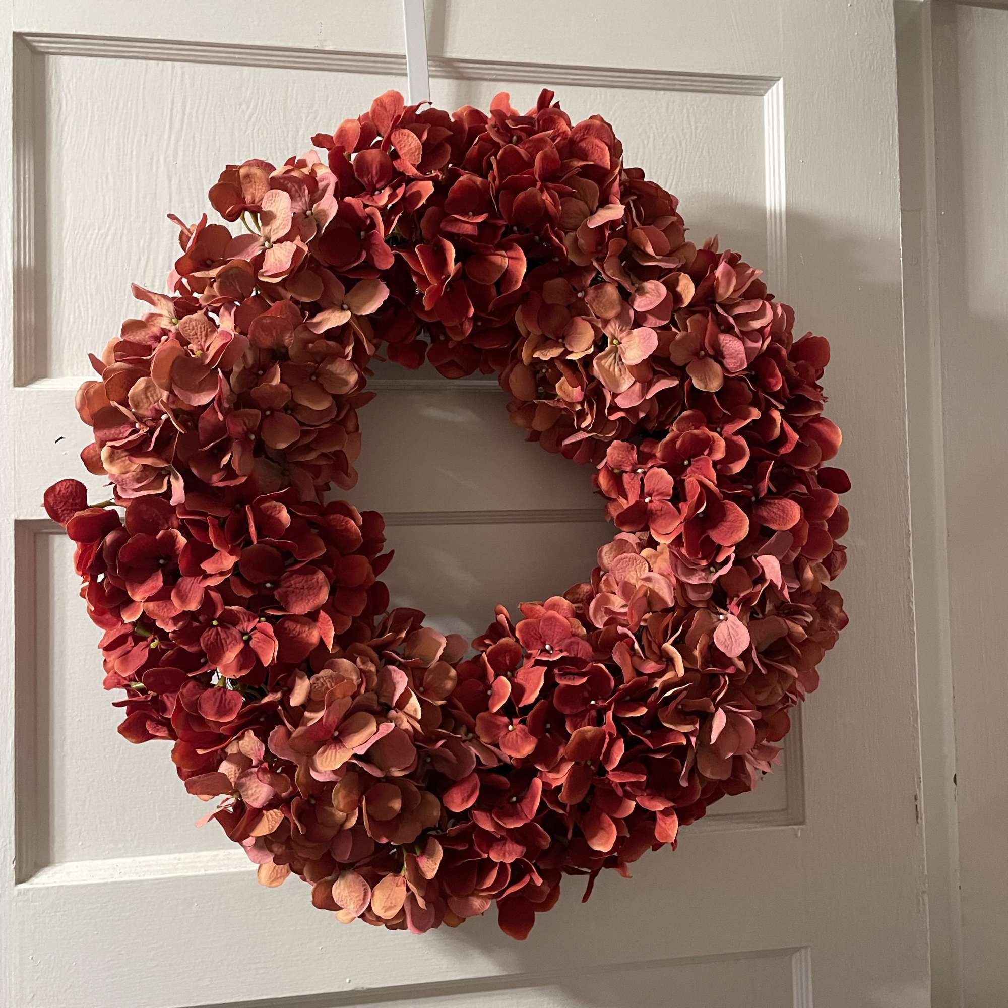 Super pretty wreath. Beautiful muted red hydrangeas are the focus of this
