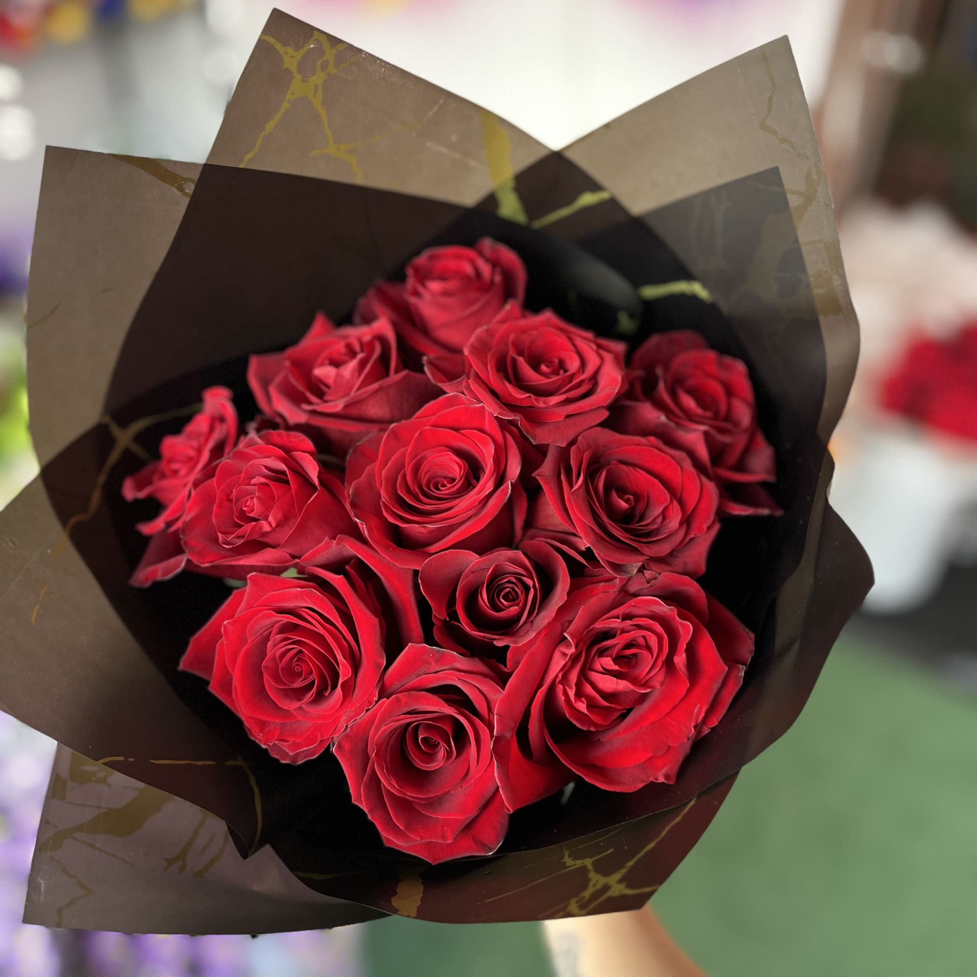 1 dozen roses in black paper