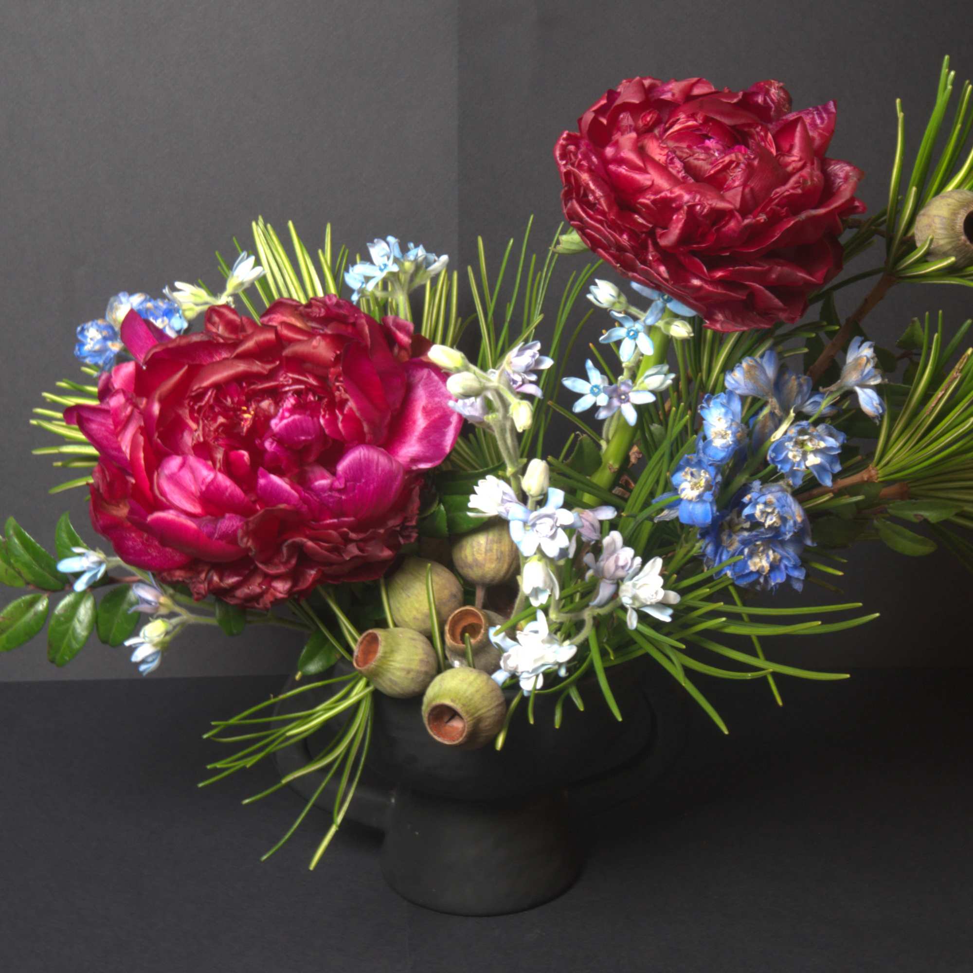 This modern ikebana arrangement highlights bold, textural blooms arranged with intention and