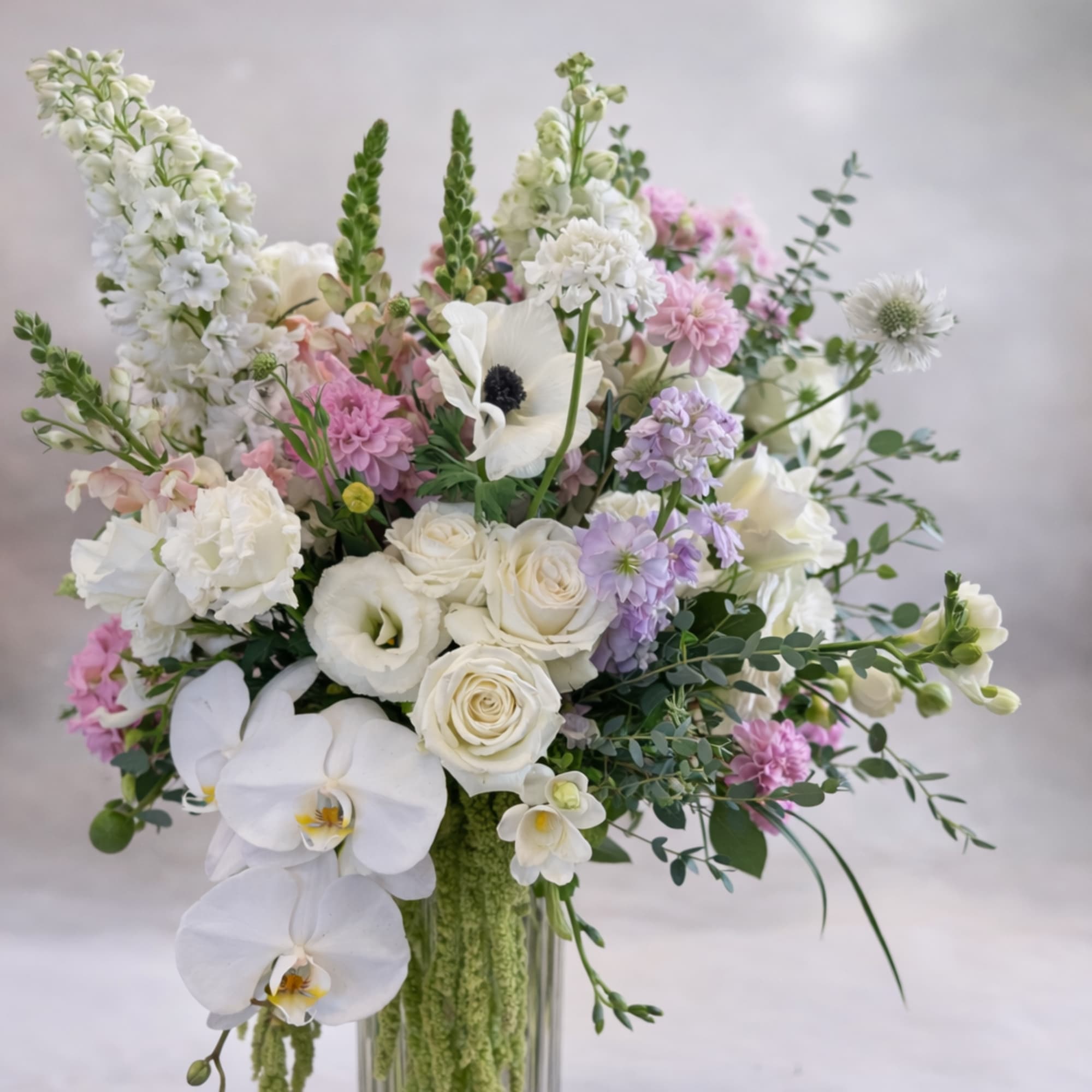 Flowers: roses, stock, delphinium, orchids, snapdragons, lisianthus, anemones, dahlias, freesia, eucalyptus, and