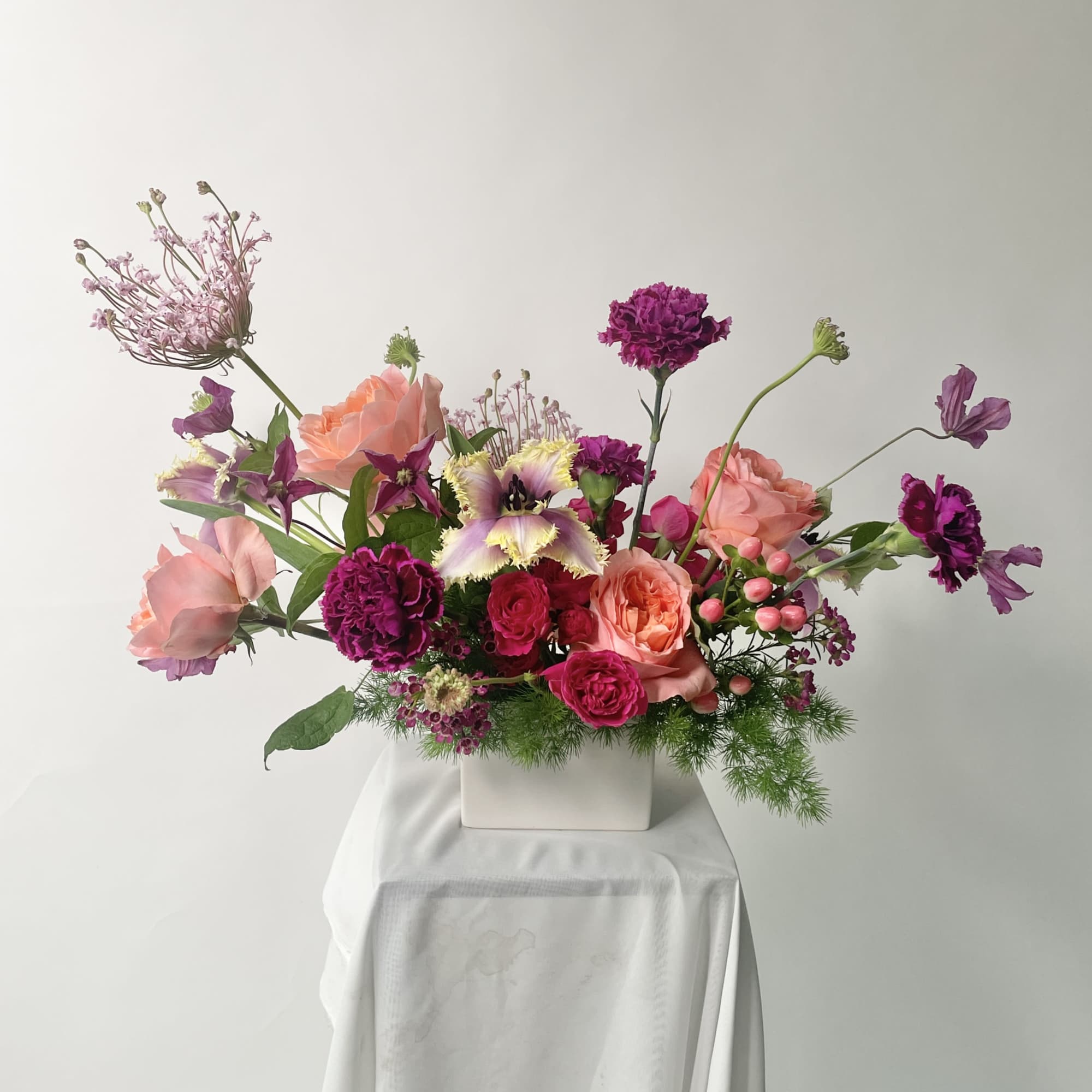 Vibrant, romantic, and full of personality, Berry Blossom is a floral arrangement