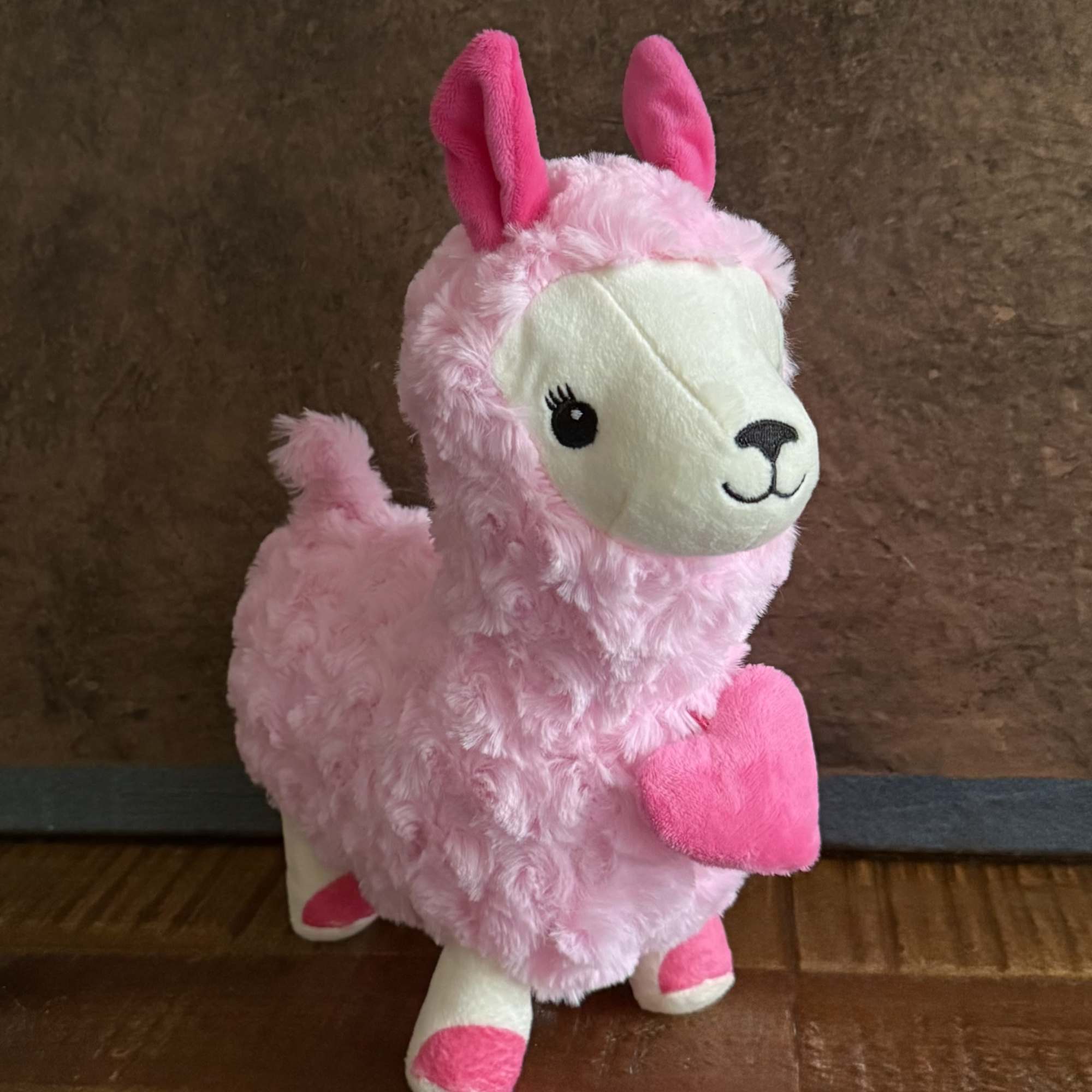 This adorable Pink Sweetheart Llama Plush is the perfect cuddle companion. Made