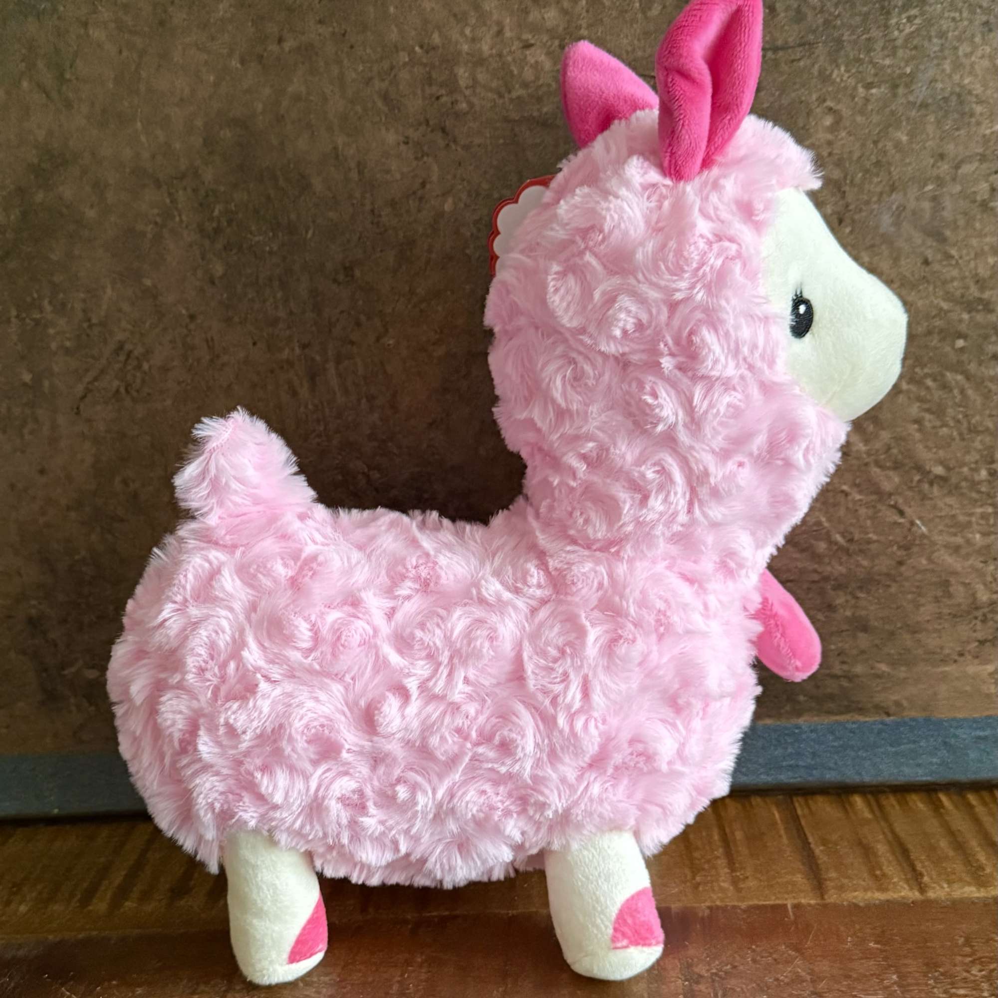 This adorable Pink Sweetheart Llama Plush is the perfect cuddle companion. Made