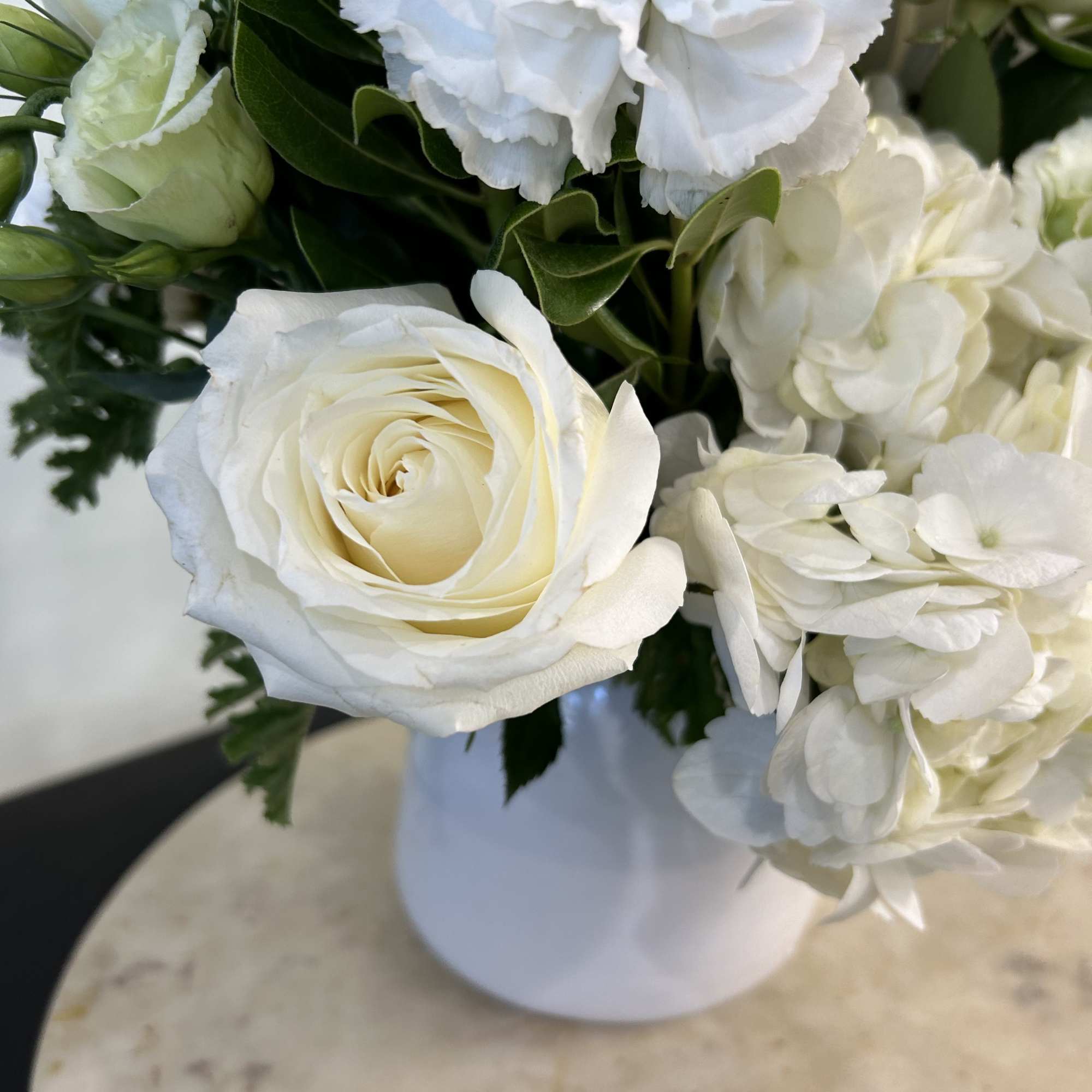 Our largest arrangement in the Winter White Collection. A white round vase